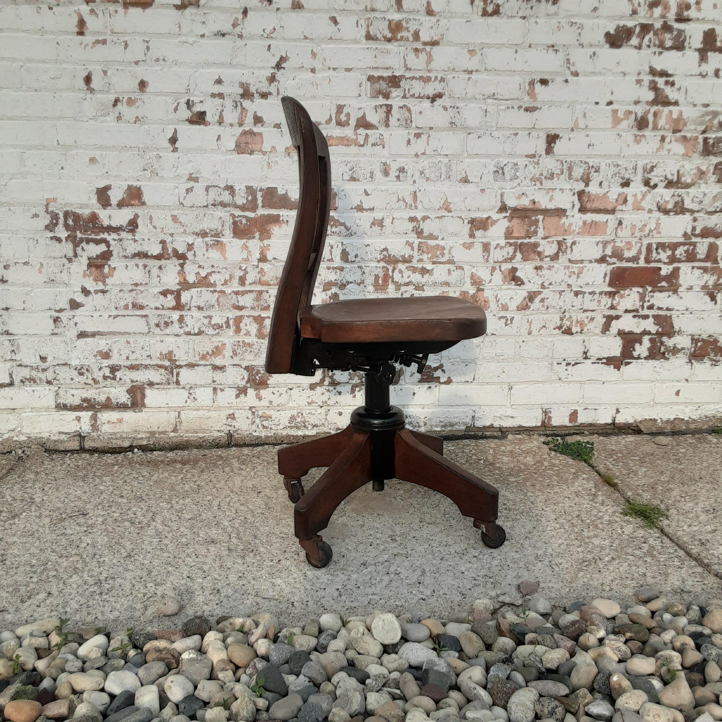 Industrial beauty at its most ingenious - this vintage Sikes swivel office chair is a treasure. Carefully sculpted hardwood and chunky metalworks combine to create an enduring and surprisingly comfortable perch. Perfect for display or for daily use.