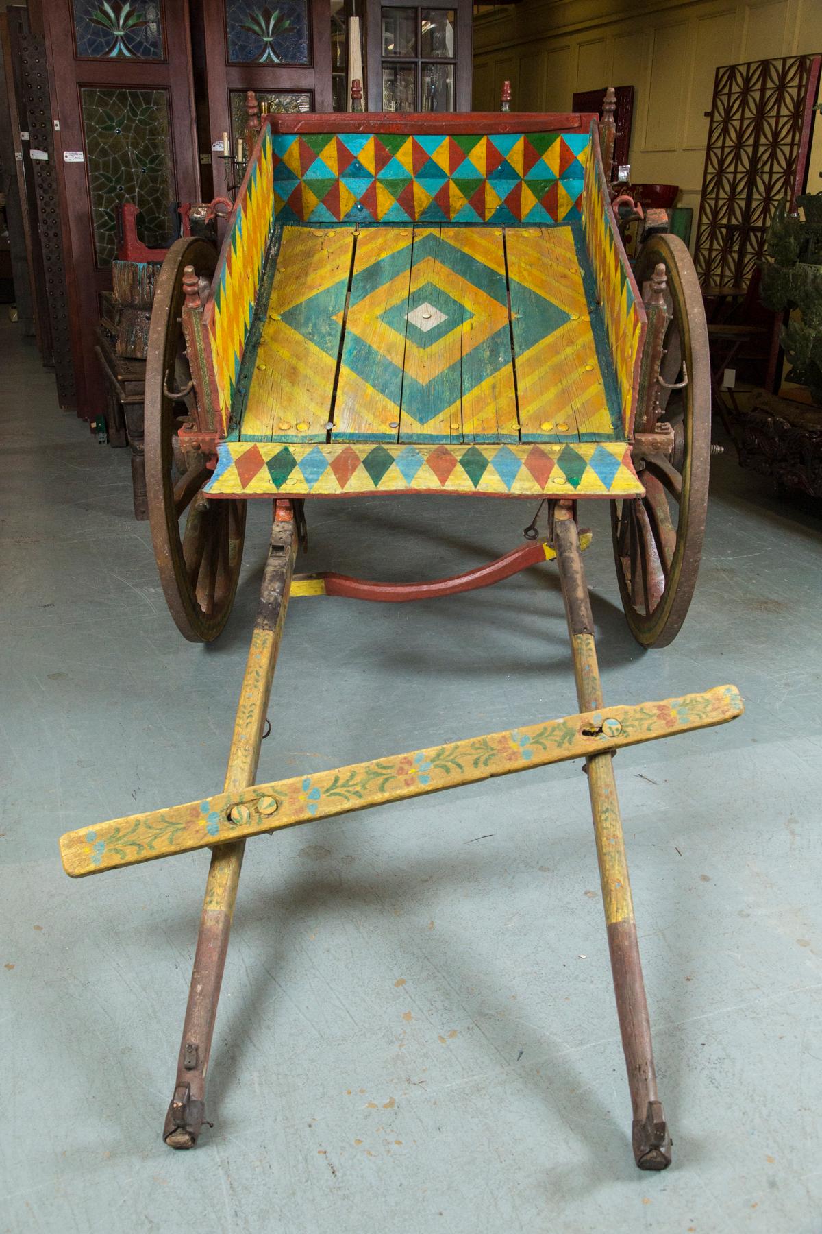 Originally these horse drawn carts were created as a means to transport fruit, food, grains, etc. but were transformed into a vehicle for cultural design. Heavily carved and decorated throughout representing moments throughout history or epic