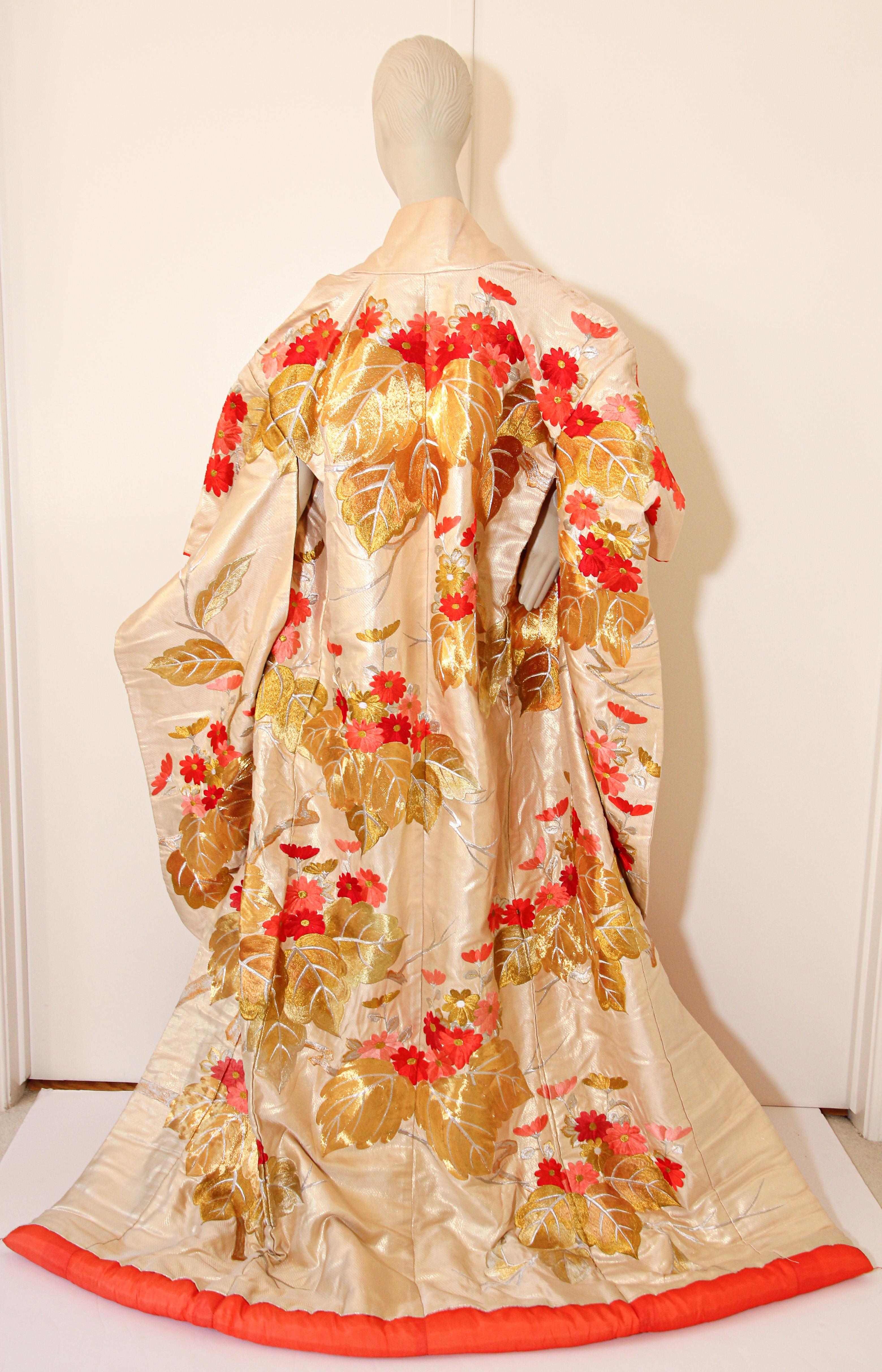 A vintage ivory color silk brocade collectable Japanese ceremonial wedding kimono.
One of a kind handcrafted fabulous museum quality ceremonial piece in pure silk with intricate detailed hand-embroidery throughout accented with floral gold and