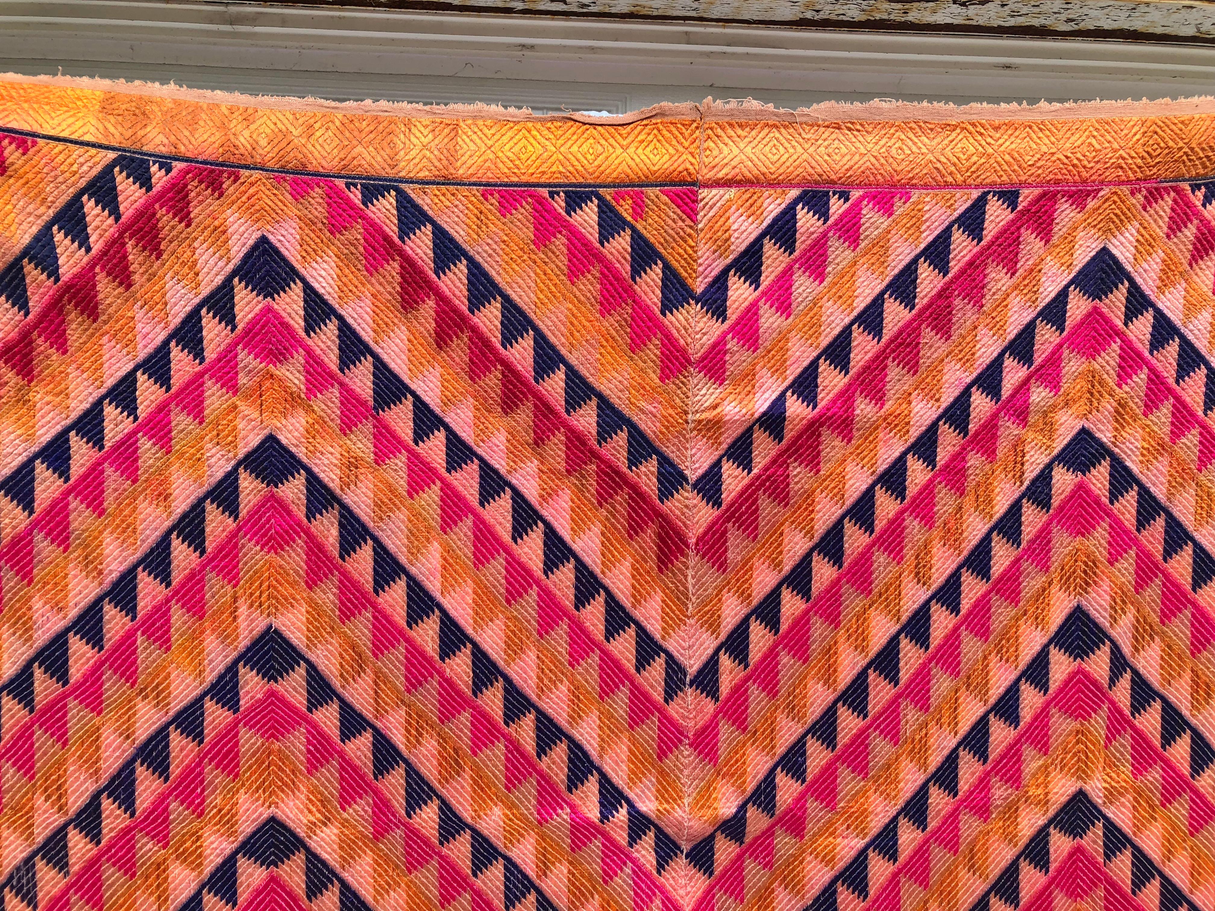 The shawl is hand woven cotton khadi cloth that is hand embroidered with vibrant silk threads. Made by the relatives of the young girl for her wedding and other special occasions. This is a very rare pattern for the phulkari bagh, Unfortunately the