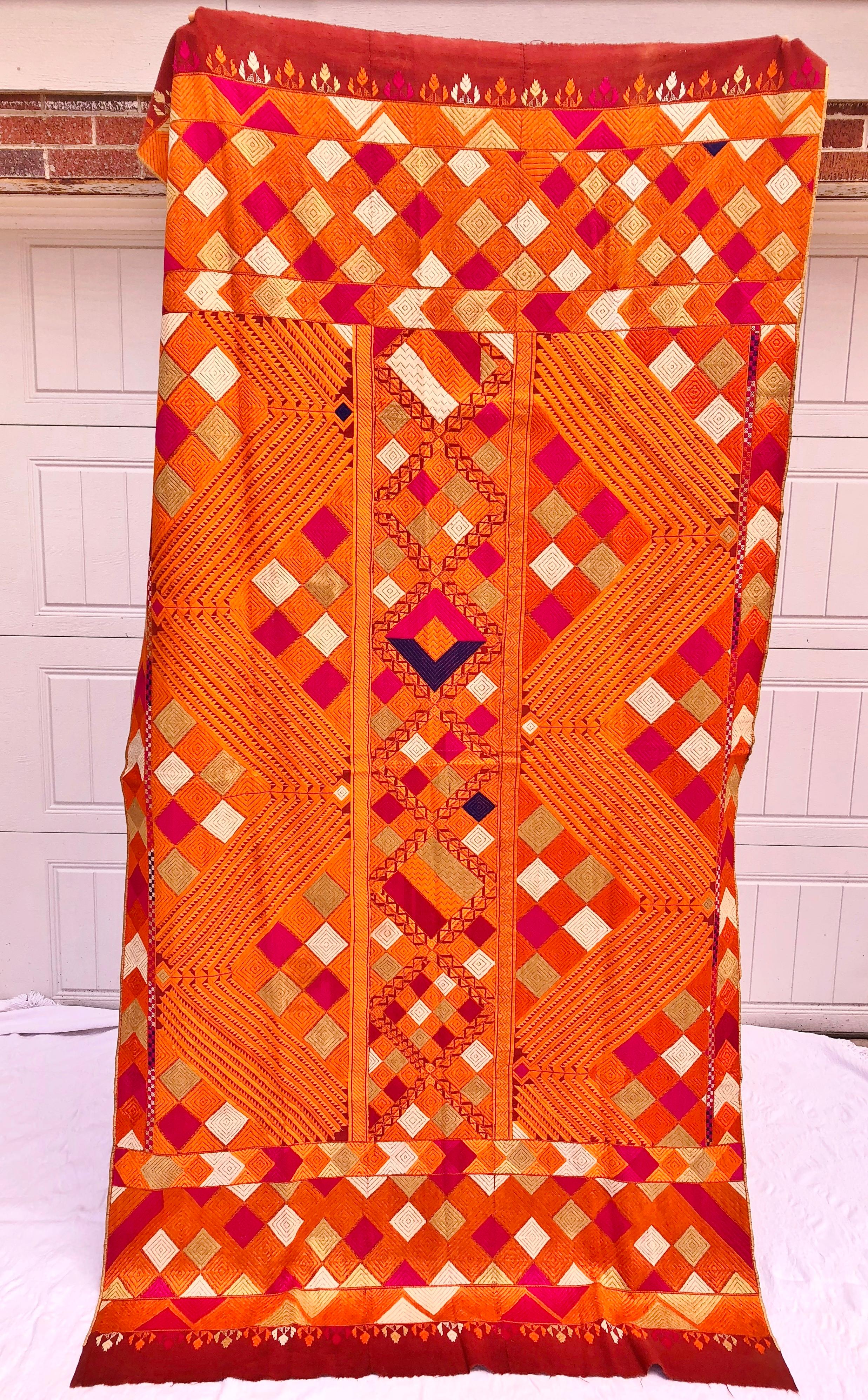 Vintage phulkari bagh wedding shawl from Punjab, India. The hand loomed cotton khadi cloth is hand embroidered with colorful silk threads by members of the young girl's family for her wedding. The shawl is in very good condition. Family heirloom,