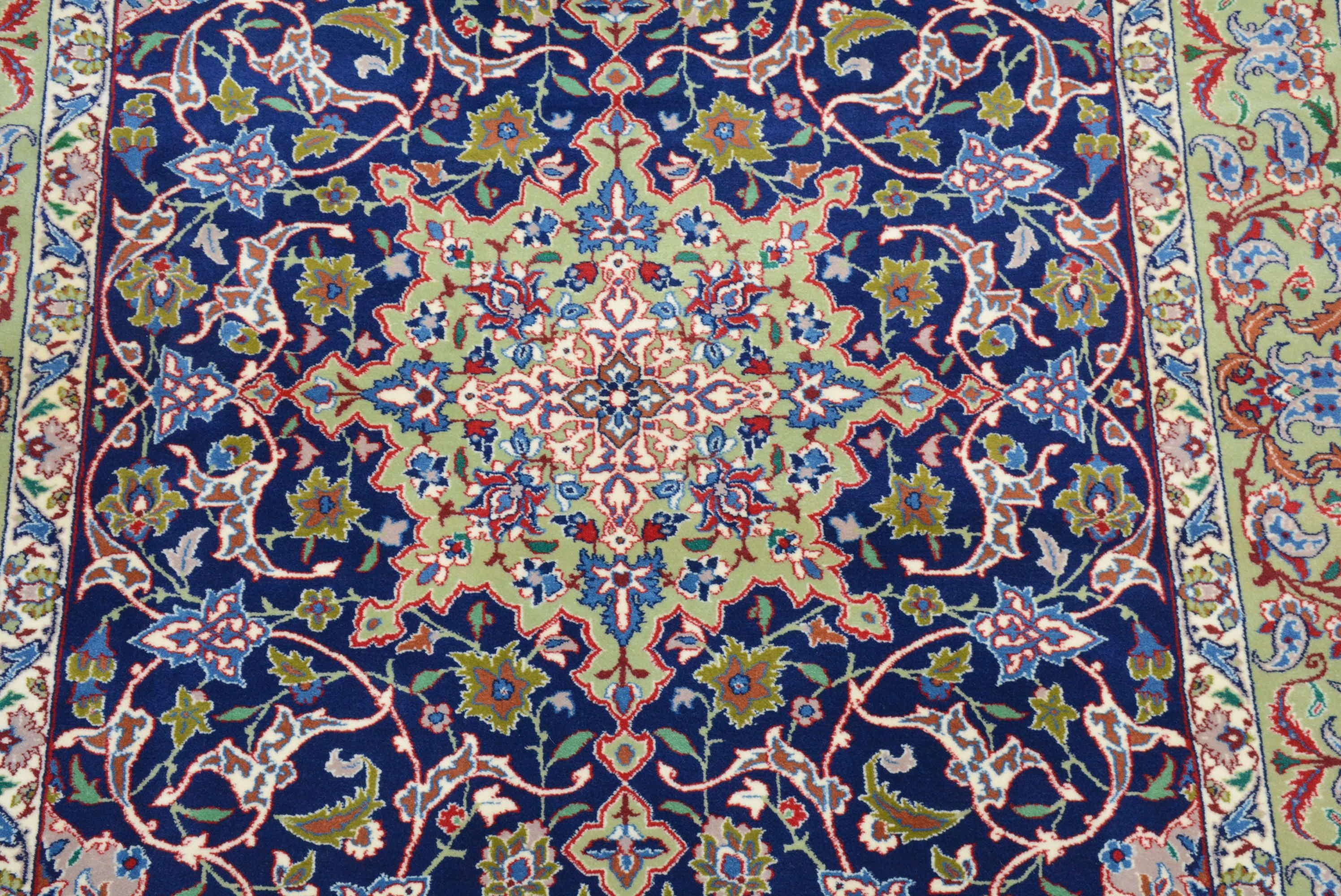Designs found in contemporary rugs from Isfahan in central Iran are based on those seen during the Safavid period (1501 - 1736 AD).  The most popular pattern has a central circular medallion on an elegantly sculpted field filled with swirling floral