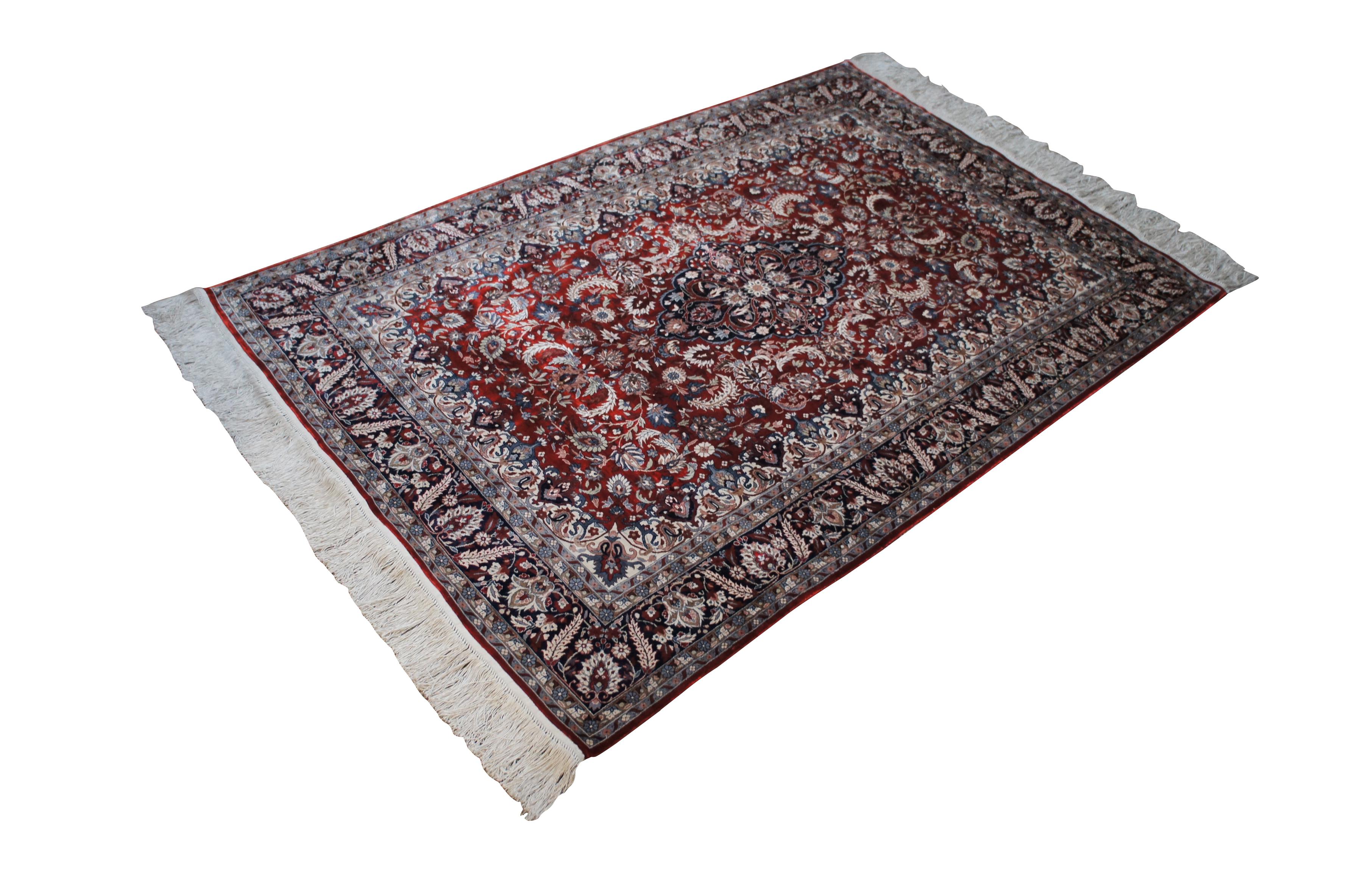 20th century hand knotted Persian Sino silk area rug / carpet with long fringe, decorated with a floral / foliate / acanthus design with central medallion in red, blue, and white.

Dimensions:
74