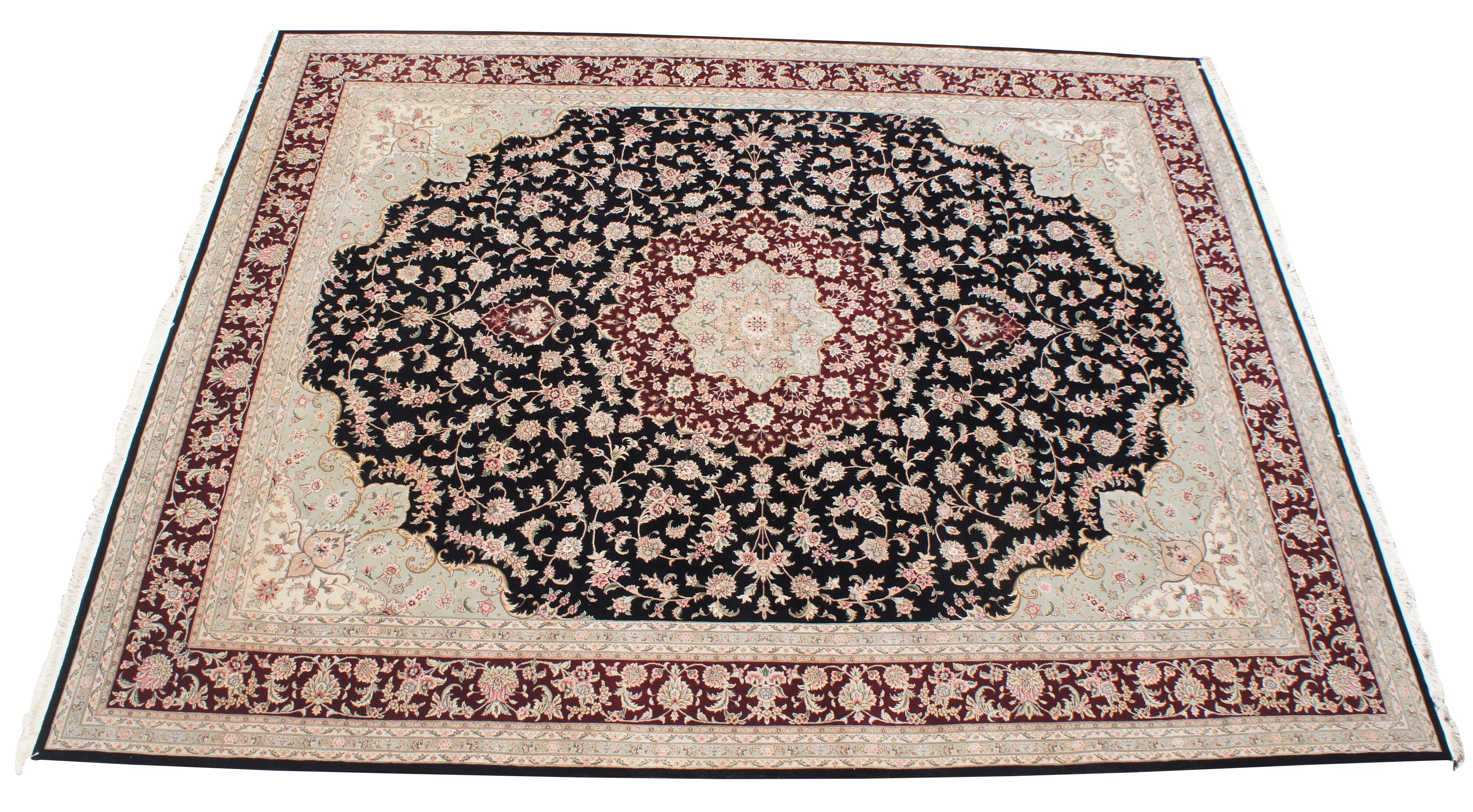 Beautiful large 12' x 15.5' Sino-Persian floral medallion area rug. Features a field of black with tan boarders and florals with reds, burgundy / maroon, green / olive, pinks and tans. Measures: 12' x 16'.
   