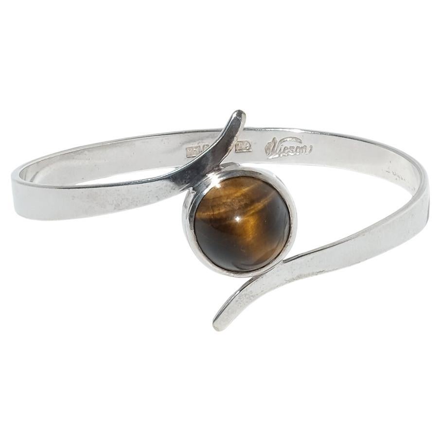 Pulsera fija vintage de plata y ojo de tigre del sueco Victor Jansson Fabricada en 1969