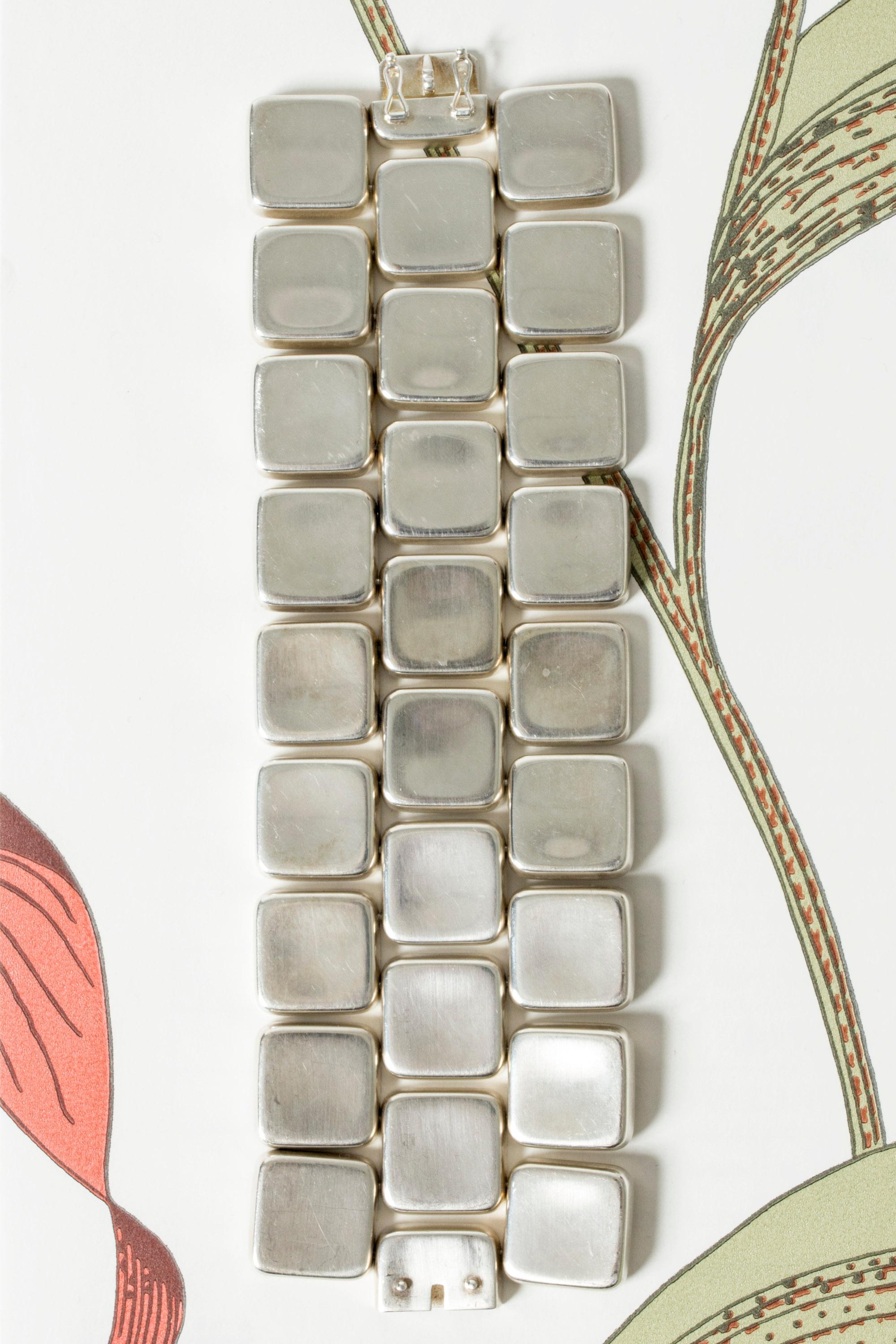 Silver bracelet by Astrid Fog, in a cuff design built up from squares. Massive silver, heavy and striking, a real power look.