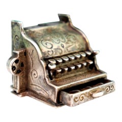 Vintage silver cash register with reliefs and drawer with opening button