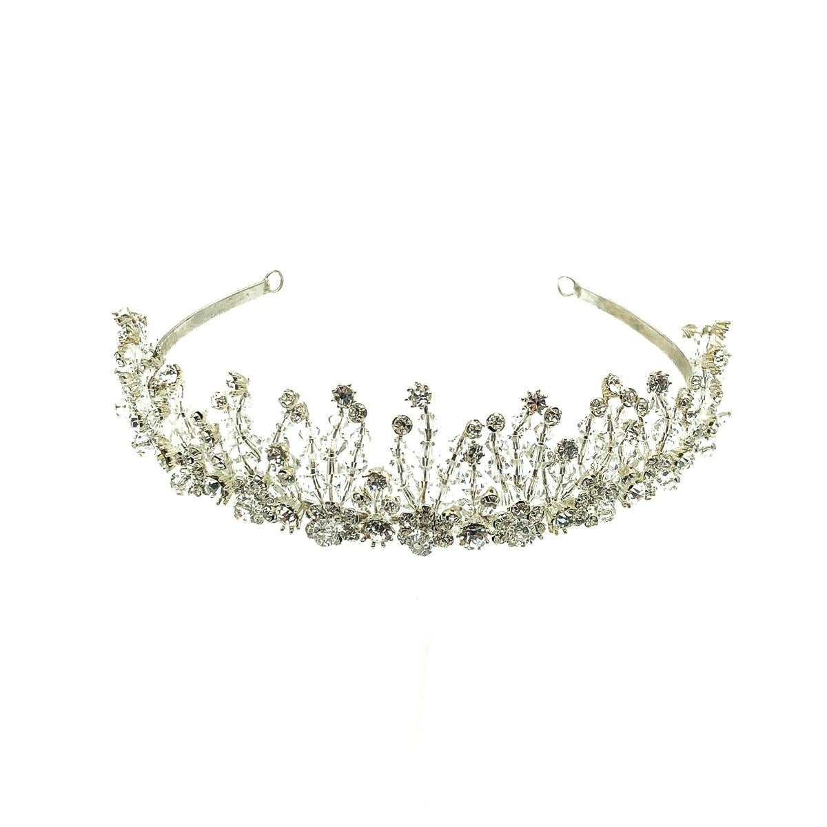 A beautiful Vintage Silver & Crystal Garden Tiara from the 1980s. Crafted in silver tone metal, faceted crystal beads and glass crystal chaton stones. Named the Garden Tiara by us as each line of drilled crystal beads, finished with crystal chaton