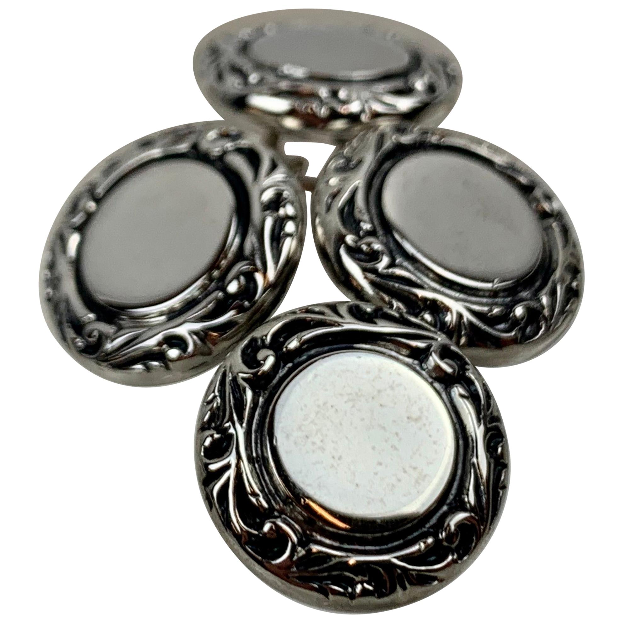 A Pair of Double Round Silver Tone Cufflinks with Scrolled Raised Borders For Sale