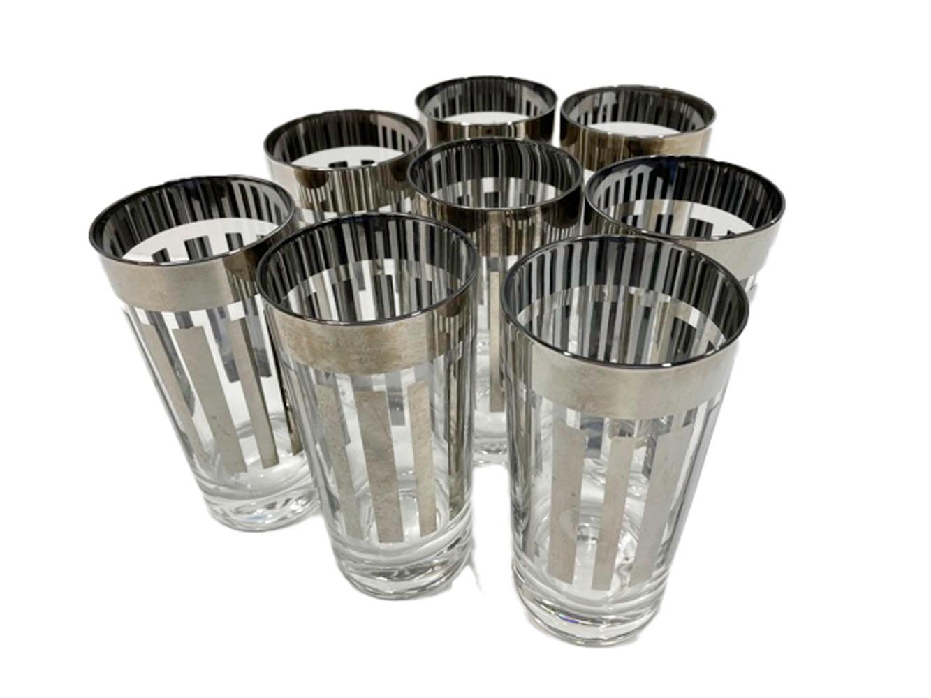 Set of eight Mid-century highball glasses decorated in silver with a wide band above vertical bars which alternate in width around the glass.