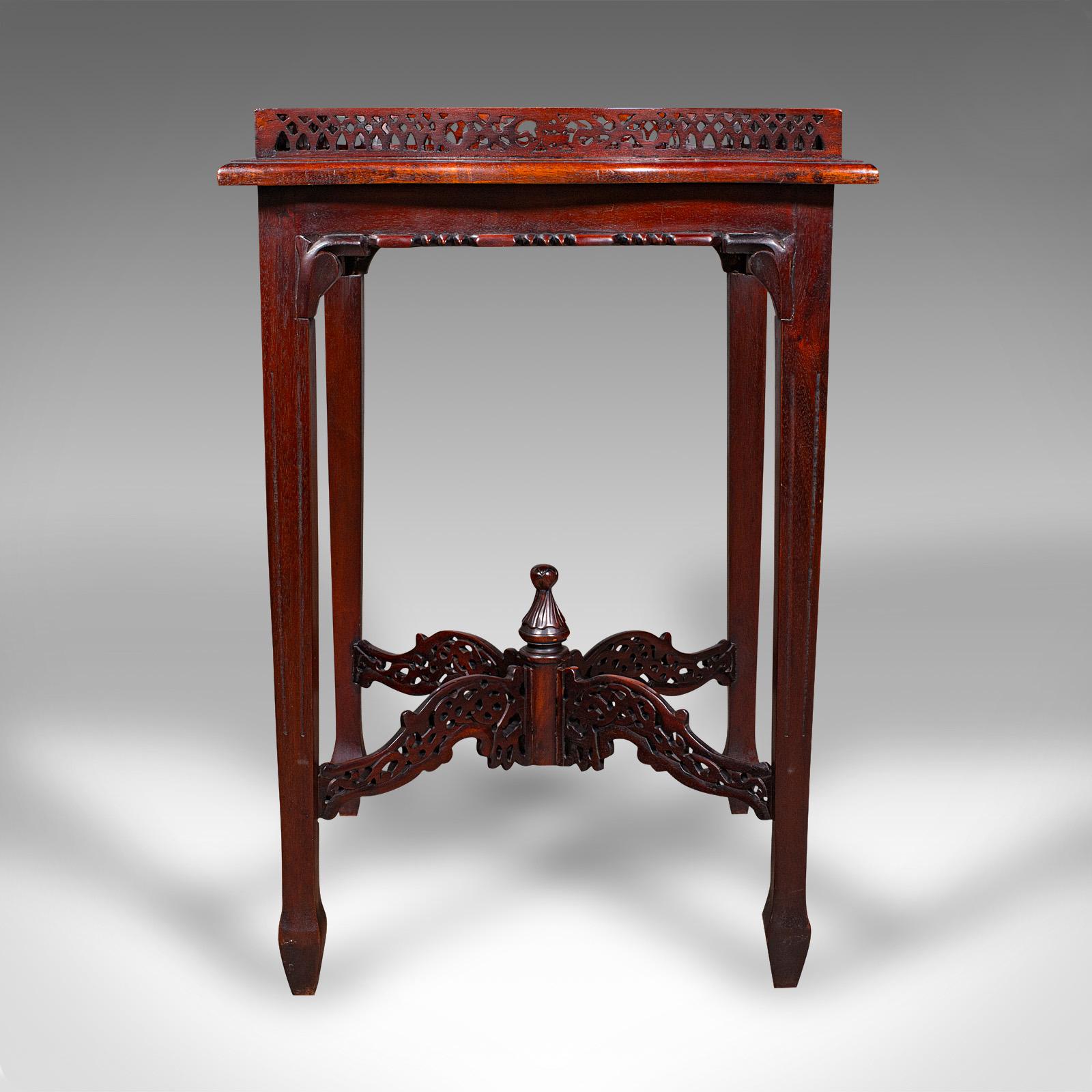This is a delightful vintage silver display table. An Oriental side table crafted in Chippendale revival taste, dating to the late 20th century, circa 1970. Wonderfully decorative and practical, ideal for use as a side or lamp table.

Elegantly