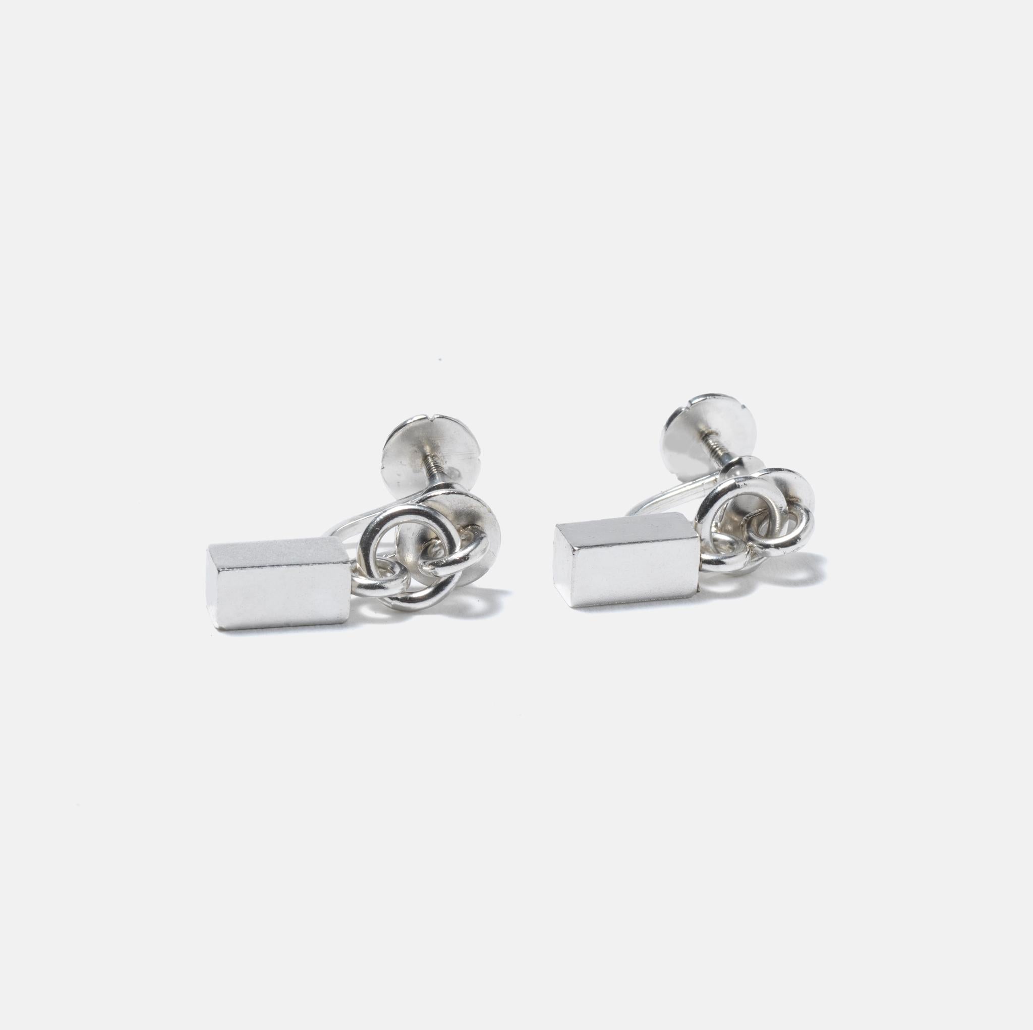 A pair of silver earrings made by Wiwen Nilsson, the most recogniced Swedish silversmith ever. This is a typical design for him using geometrical shapes for his jewelry.
Even the stamps are beautifully made, he was a perfectionist in all small