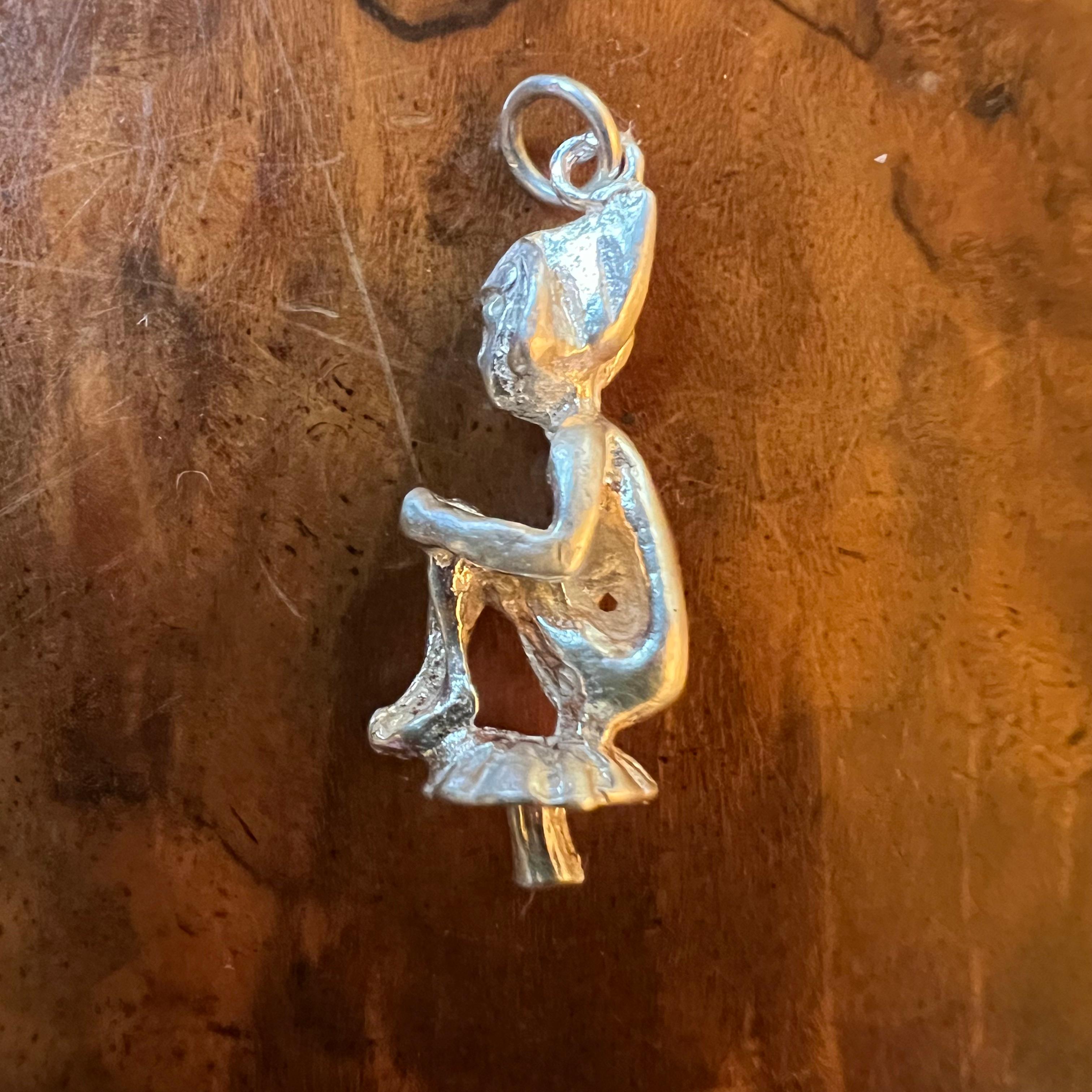 Elf sitting on mushroom pendant/charm, jewellery is preowned and is sold in 