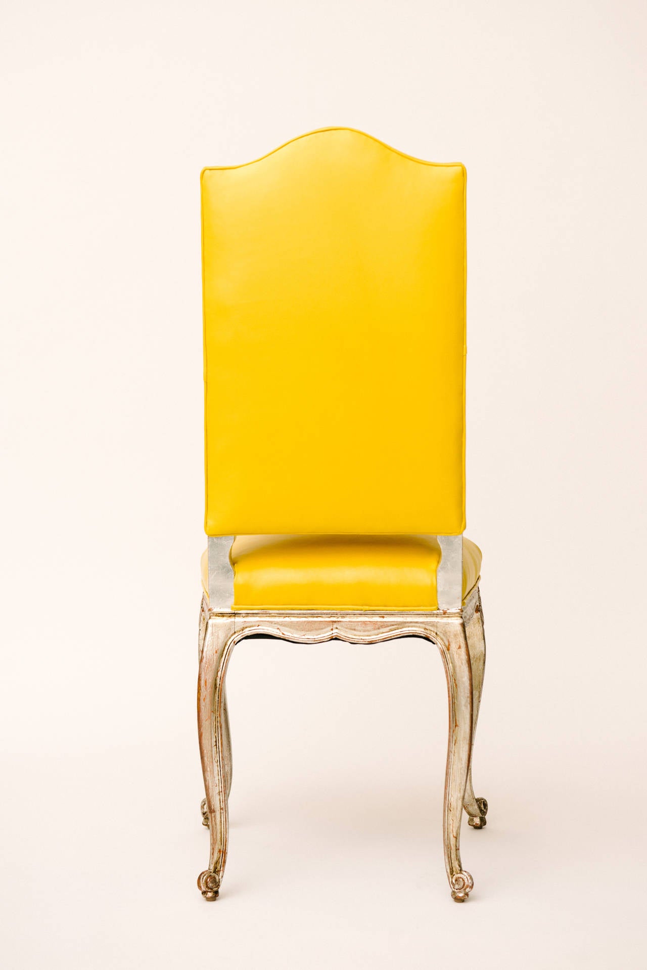 Vintage silver gilt Louis XV style chair newly upholstered in a sunny yellow kidd leather.