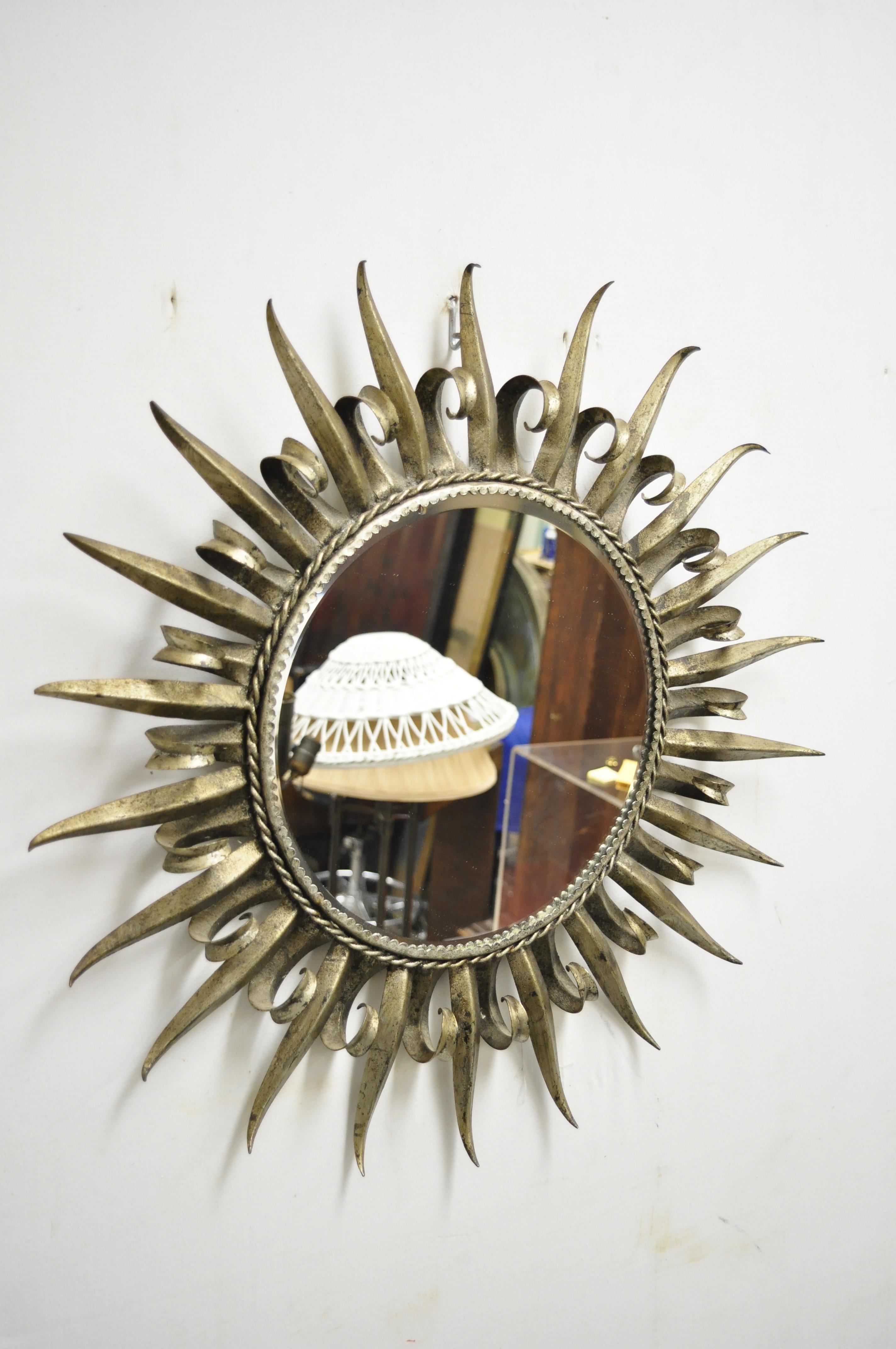 Vintage silver gilt metal Hollywood Regency Italian style round sunburst wall mirror. Circa Mid to Late 20th Century, Spain. Measurements: 23