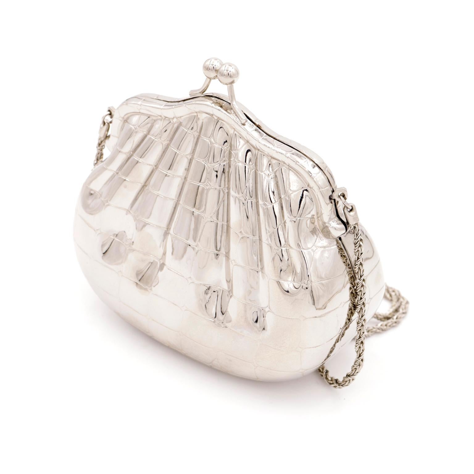 We love this vintage 1980s alligator embossed silver plated handbag with the interesting faux gathering & a kiss lock clasp. This bag was made in the 1980's in Italy for Nordstrom and it is such a unique vintage handbag. The unusual faux gathering