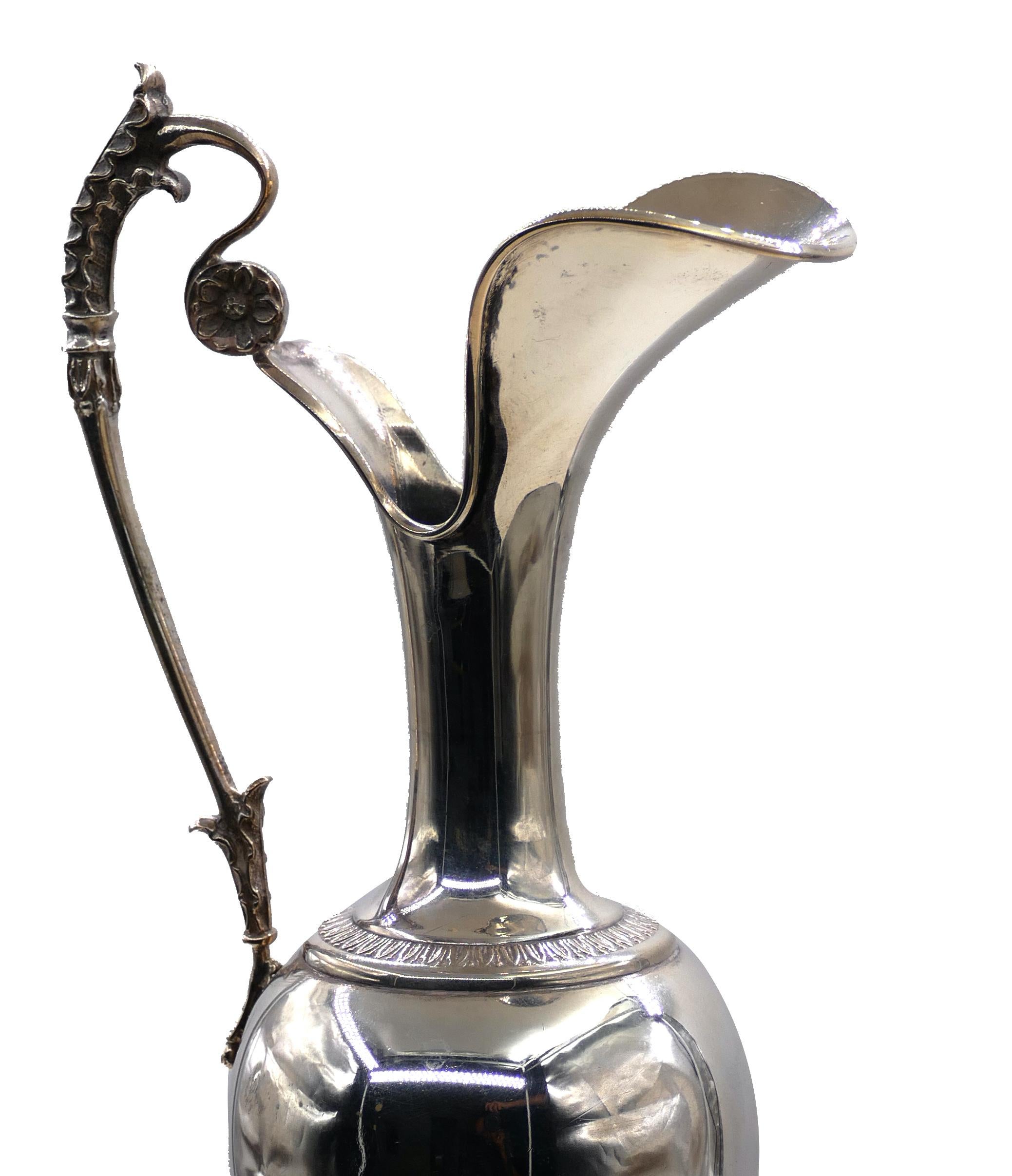 Silver Jug is an ornamental silver jug, (800 gr silver) of Italian manufacture, with a leaf motif on the handle.

Of incredible elegance and sinuous line, this decorative object was realized, circa 1950s of 20th century. 

Collect this wonderful