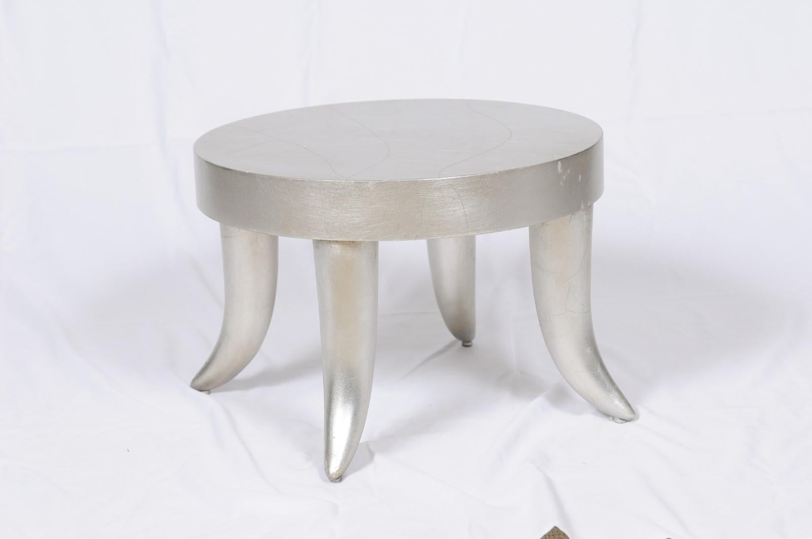 Bill Sofield for Baker Furniture. A vintage 1990s silver leafed tusk stool. This is a highly desired design by Bill Sofield and currently a little difficult to find. The stool is very sturdy and sound. The silver leaf finish has some wear and