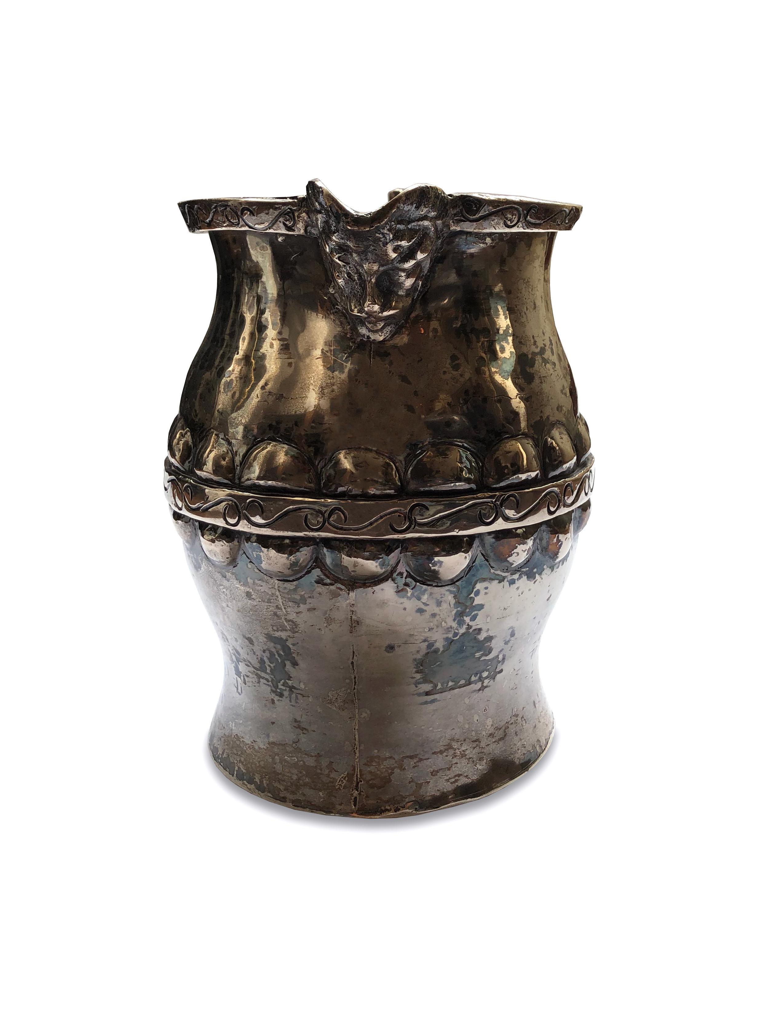 Antique small silver pitcher / creamer. Silver casted piece with metal engraving and a carved face on the mouth serving area. Stampled on the inside. 

Property from esteemed interior designer Juan Montoya. Juan Montoya is one of the most