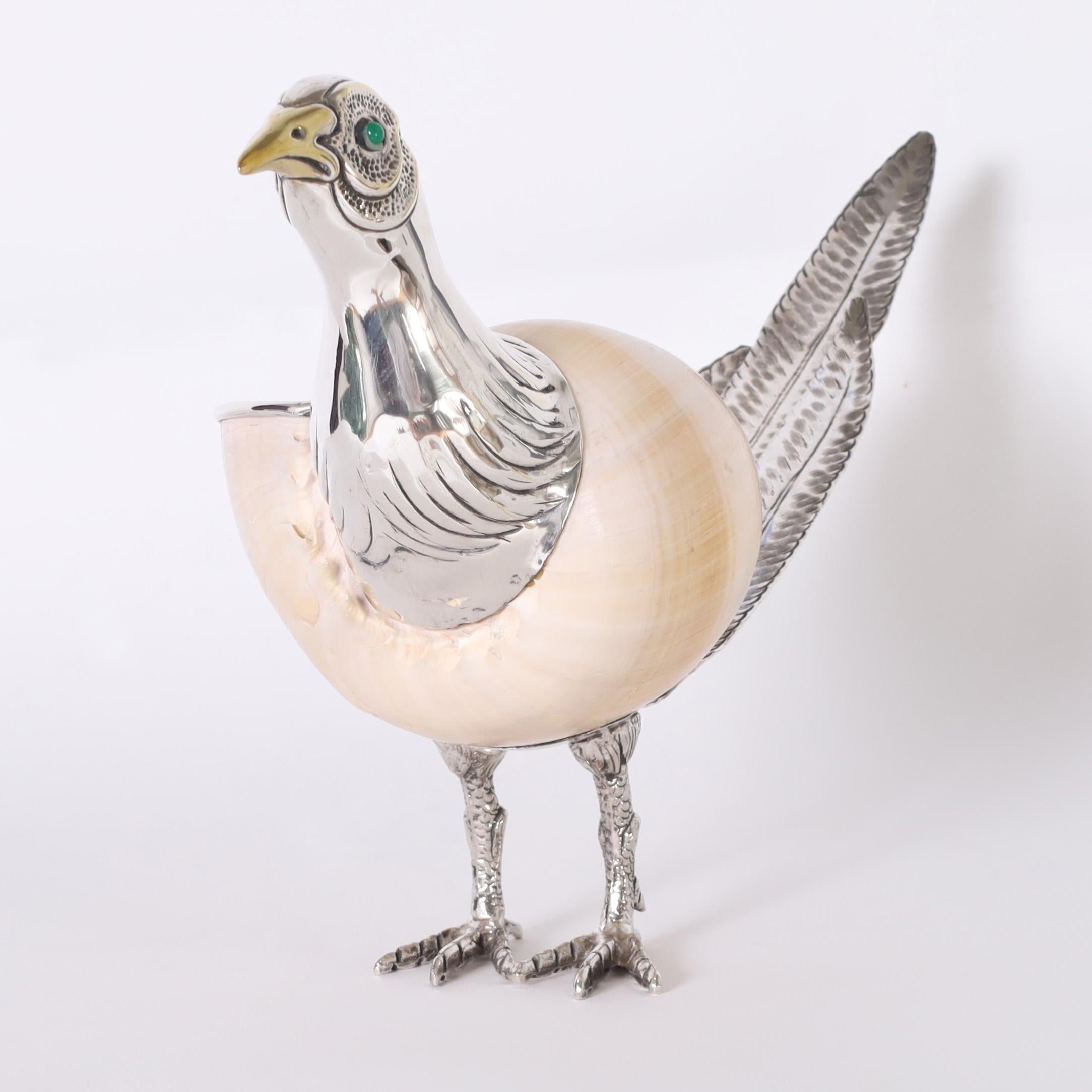 Standout mid century Italian pheasant sculpture crafted with a conch shell ambitiously enhanced with silver plated brass head, tail, feet and quizzical expression. Signed Binazzi on the bottom.