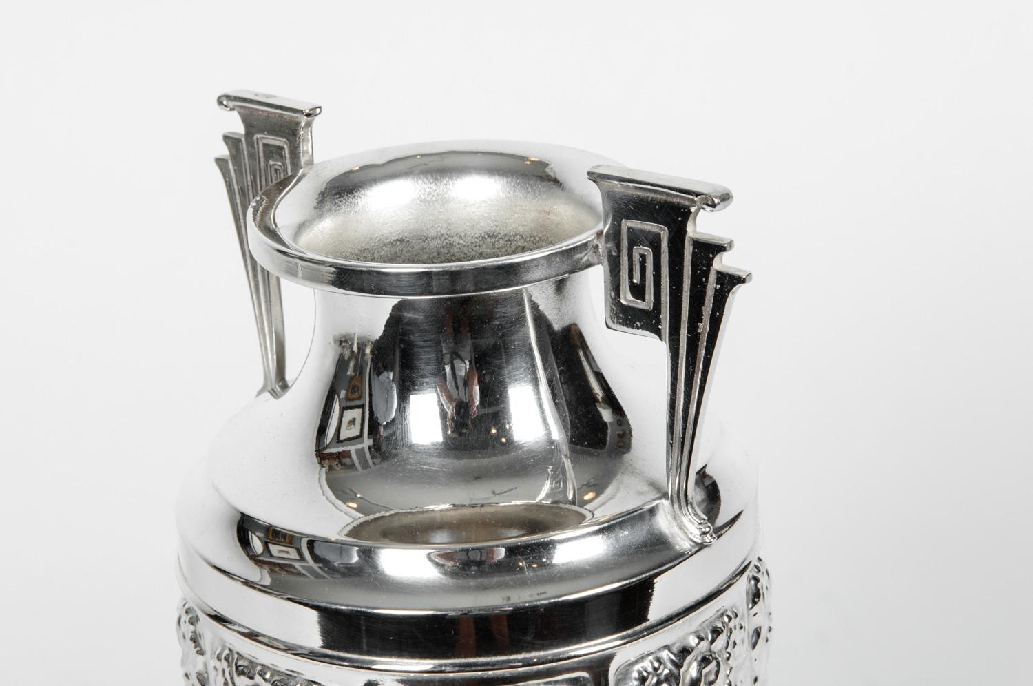 Vintage silver plate Art Deco Geek revival urn / decorative vase. The piece is in excellent condition. The vase / urn measure about 13.5 inches high x 6 inches diameter.