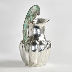 Brocca d'argento vintage con manico a pappagallo