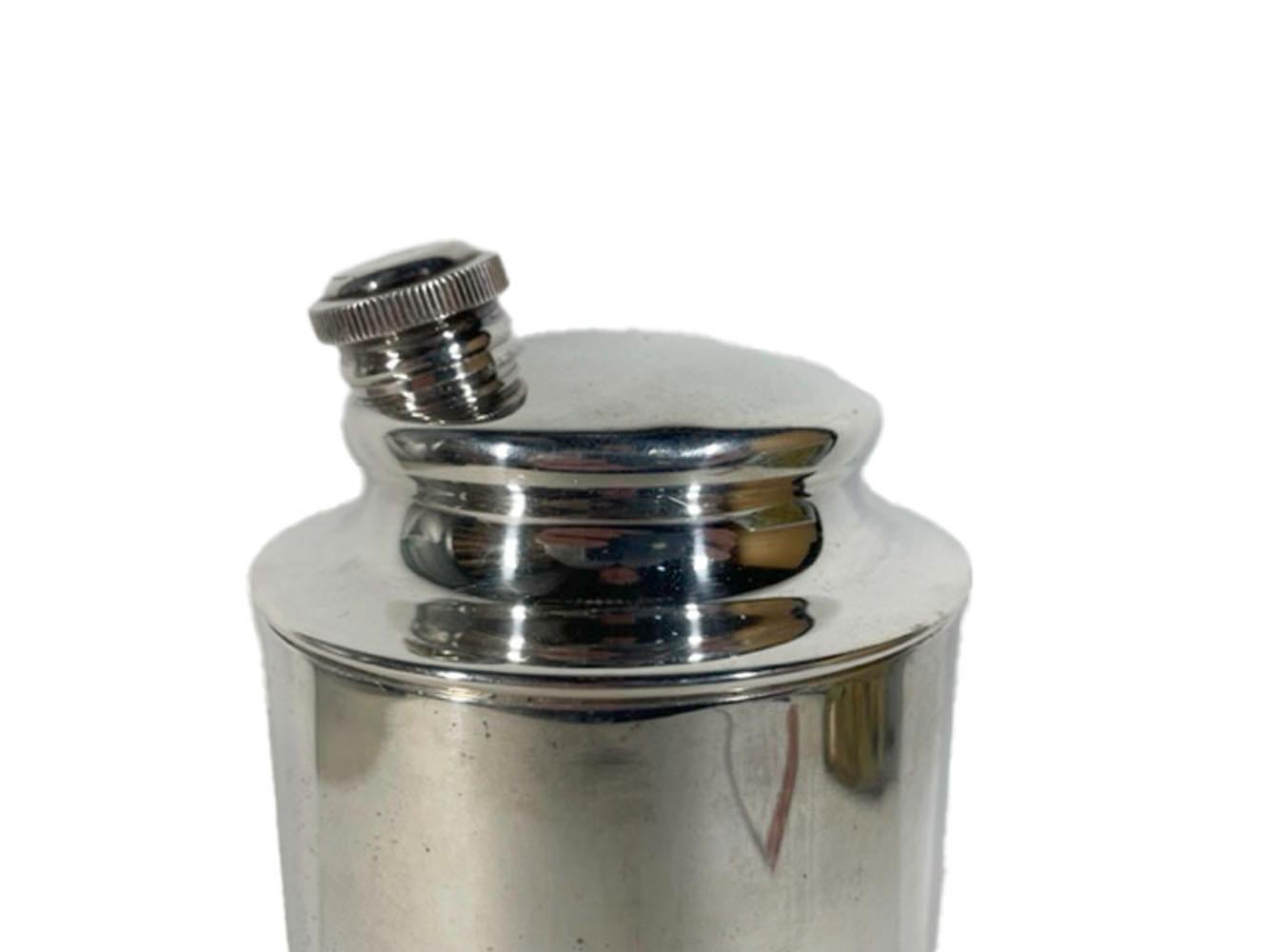 Large vintage silver plate modernist cocktail shaker of cylindrical form with a low-profile lid having an off-center angled pour spout.