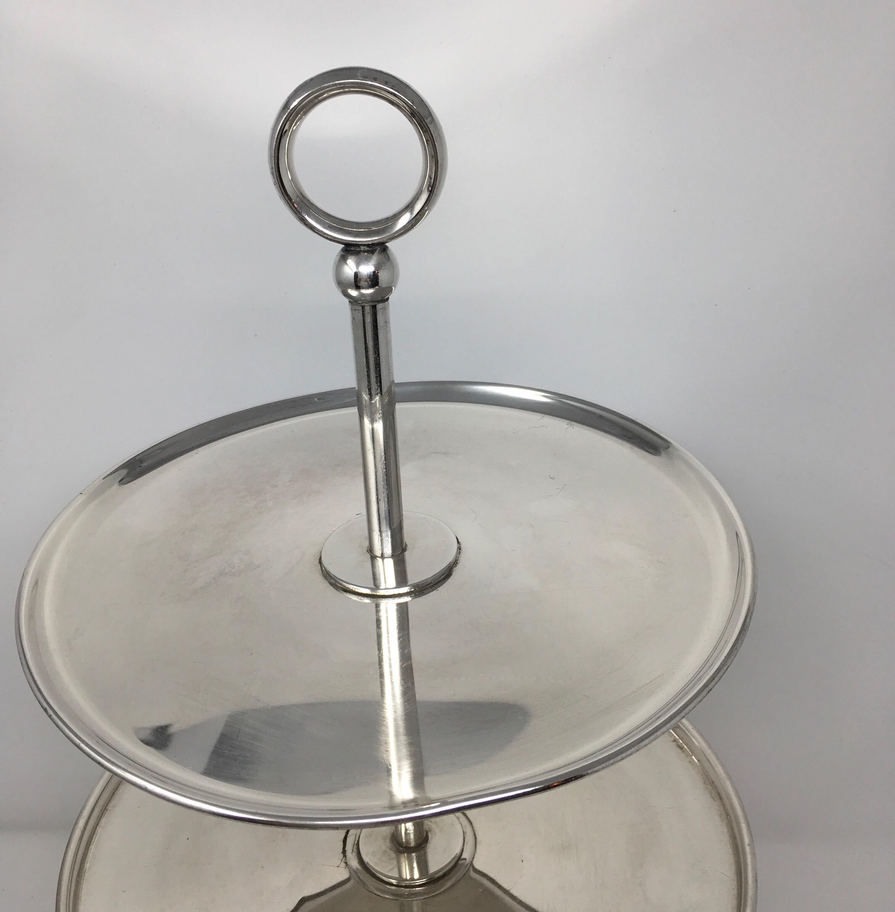 Found in the South of France, this beautifully crafted vintage 3-tier dessert stand from polished silver plate, is characterized by classically clean and understated lines. Suitable for both formal and informal dining, this stand will lend a lavish