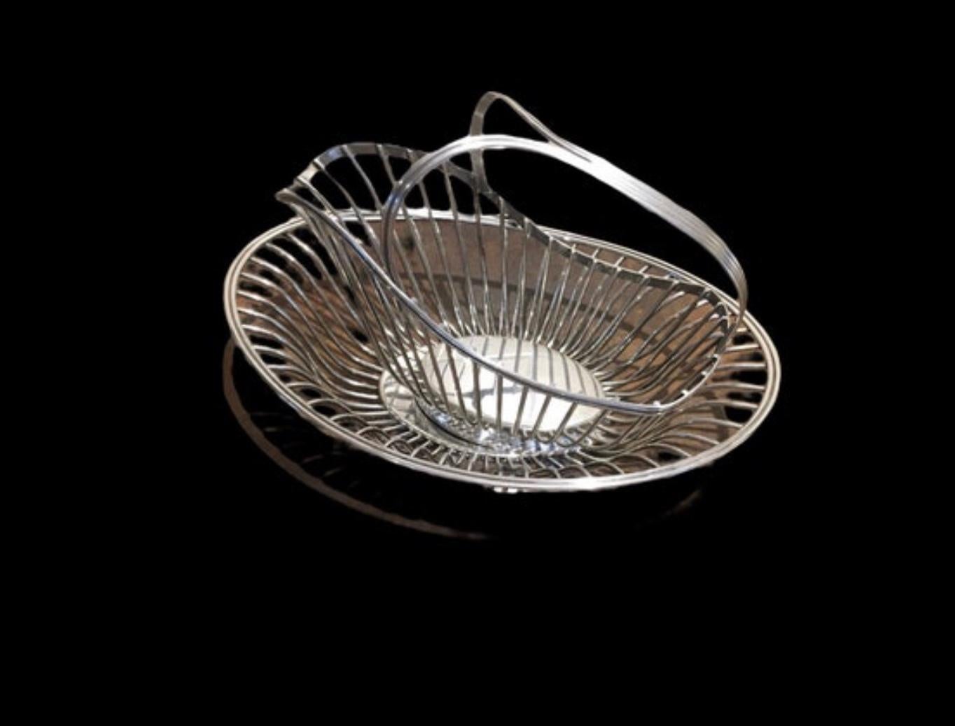 Vintage silver plate bread basket and wine holder by Galia Christofle 
Made in France 
Both pieces are stamped with the makers mark
In very good condition 
Approx dimensions of the bread basket 30.5 cm long x21 cm wide
Wine bottle holder 11 cm wide