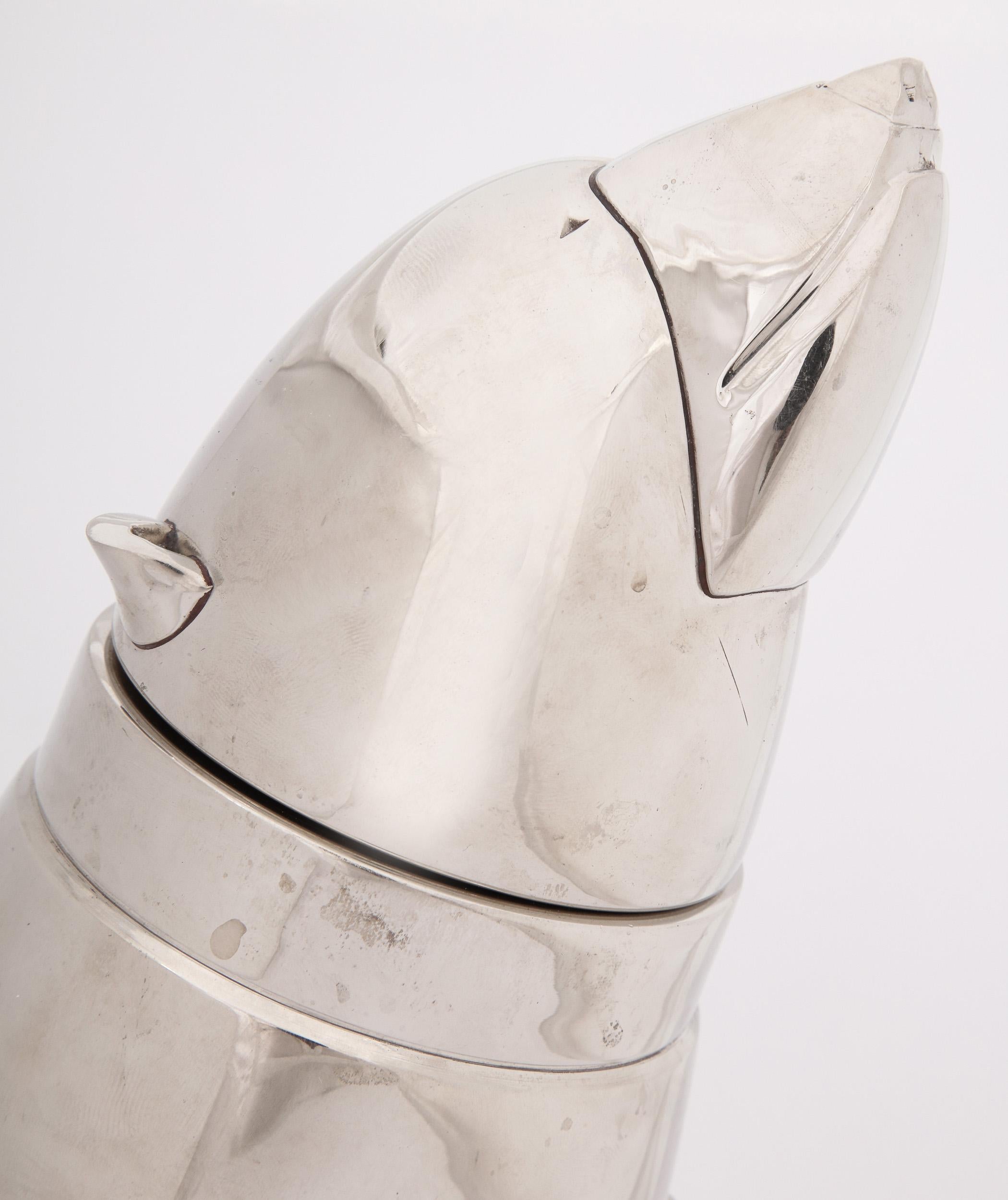 'Polar Bear' cocktail shaker,

circa 1930s.

A very heavy gauge, silver plated cocktail shaker in the form of a polar bear, the head removing to reveal the strainer.

Good condition. Normal wear consistent with age and use. 

Measures: 10.5