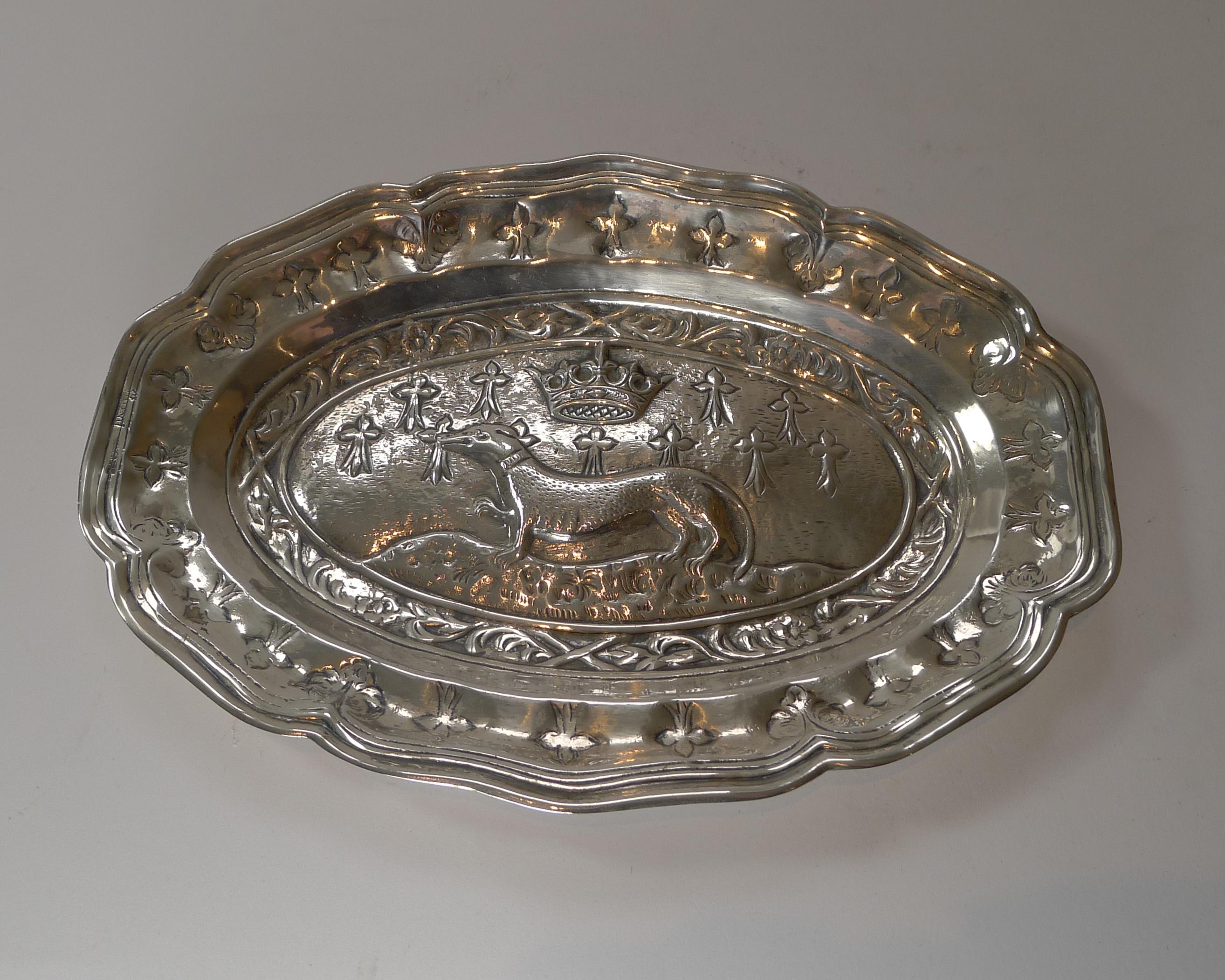 A terrific and highly decorative Spanish silver plated tray or dish with a raised scene of a stylised Greyhound with a crown above, a lovely subject.

Signed on the back by the famous Spanish silversmith's 