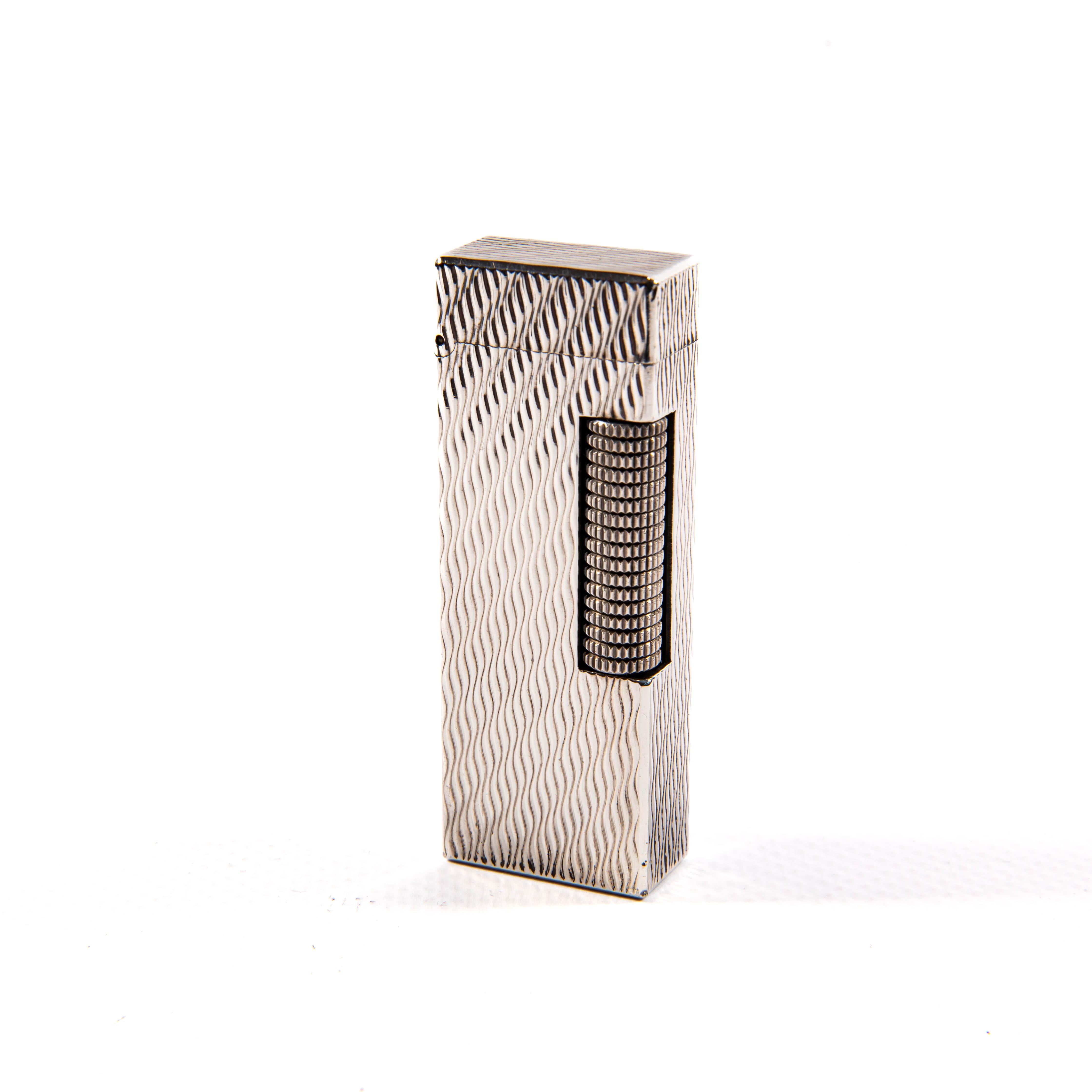 The prestigious house of Dunhill, a pinnacle of luxury and distinguished craftsmanship, is revered for its timeless lighters that have captured the hearts of many since the early 20th century. Known for their innovative design and enduring style,