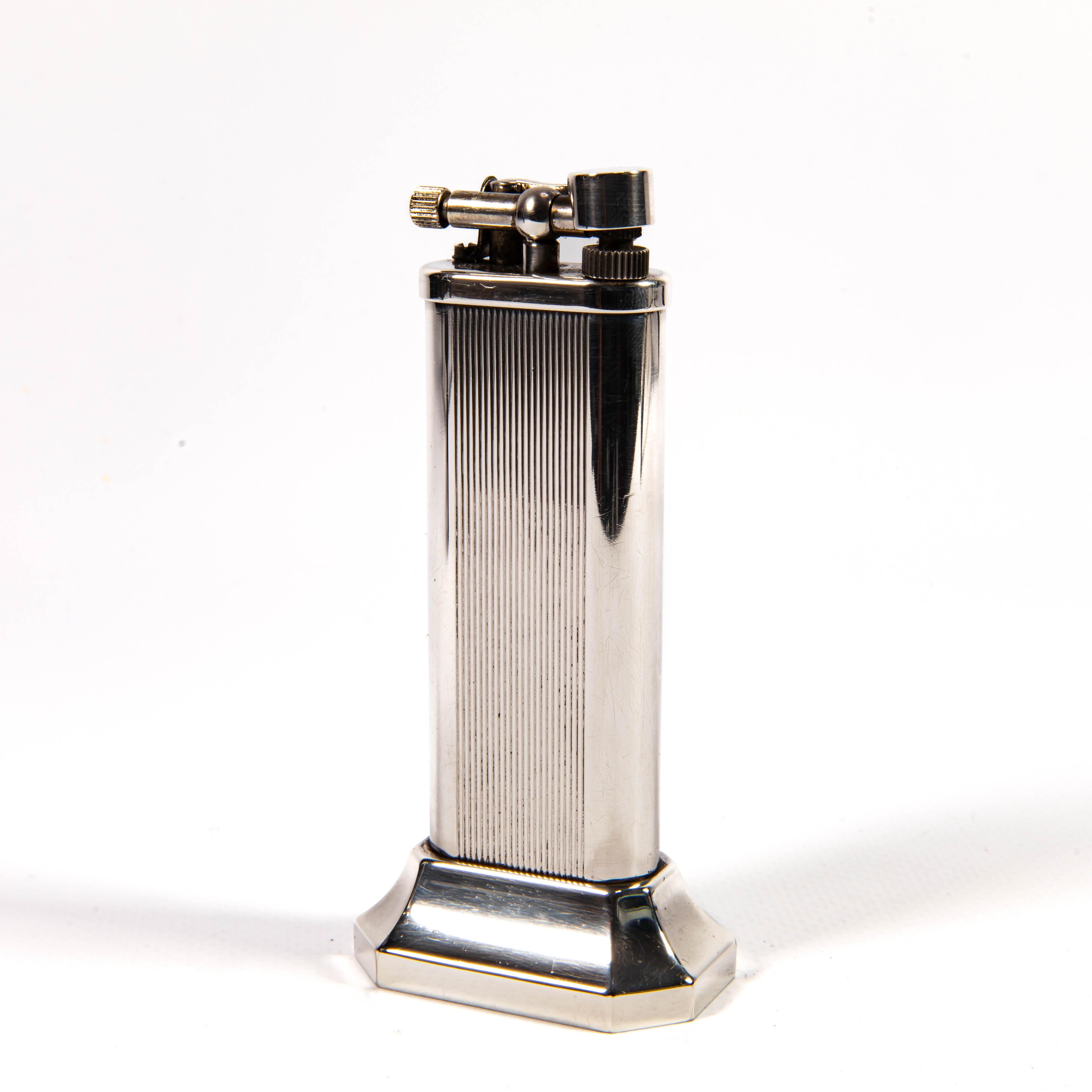 This elegant Dunhill Unique Table lighter, crafted in the 1980s, stands as a testament to the brand's storied heritage in luxury lighter design. Alfred Dunhill revolutionised the world of smoking accessories, delivering an unmatched blend of