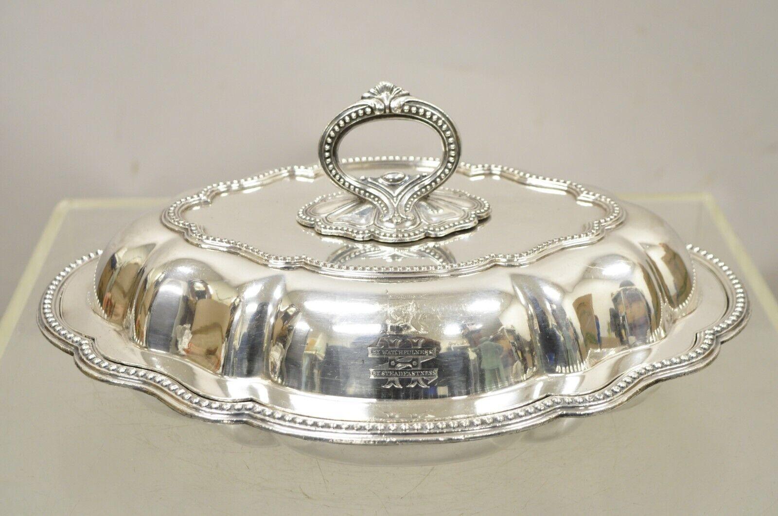 Vintage Silver Plated English Victorian Style Lidded Vegetable Serving Platter. Item features an ornate Removable Handle, Scalloped Edge, “H and Lion Engraved Monogram”, Original Hallmark, Quality English Craftsmanship. Circa Early To Mid 20th