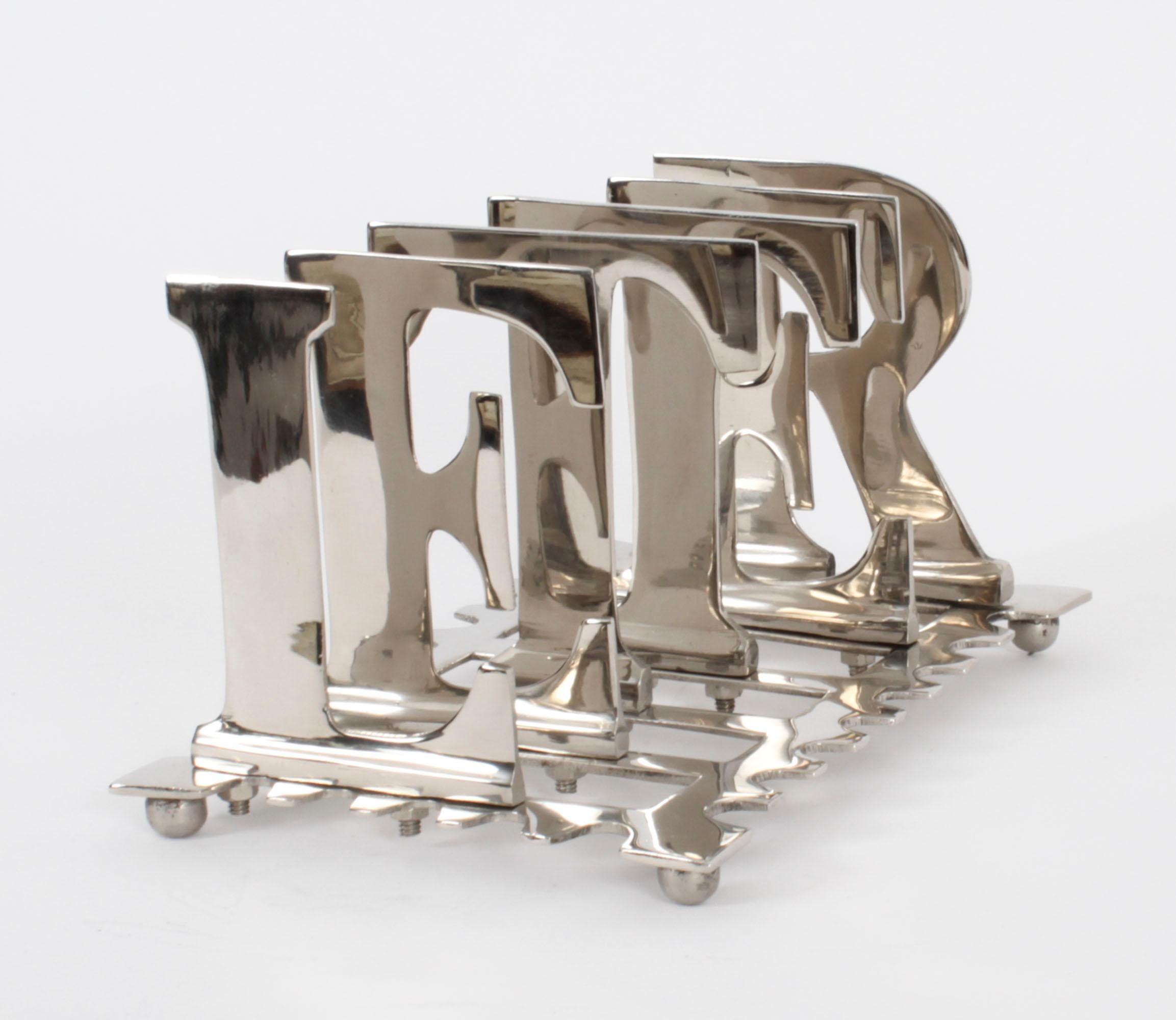 An attractive and unusual vintage silver plated letter rack, late 20th Century in date.

The letters 