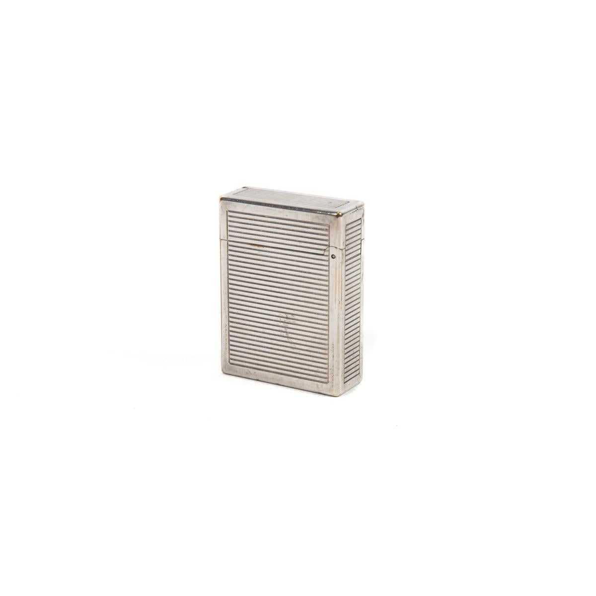 Vintage Silver Plated Ligne 1 ST Dupont Lighter 1970s

The iconic S.T. Dupont name is known for quality, well-made cigarette lighters and other luxury implements. The company’s origin can be traced to Simon Tissot-Dupont opening his workshop shop in