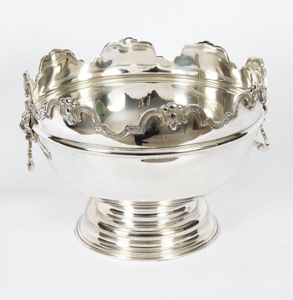 A gorgeous vintage silver plated Monteith punch bowl dating from the late 20th century.

It has embossed decoration around the rim and lion's head handles.

This punch bowl is also ideal as a champagne cooler.

The quality and craftsmanship