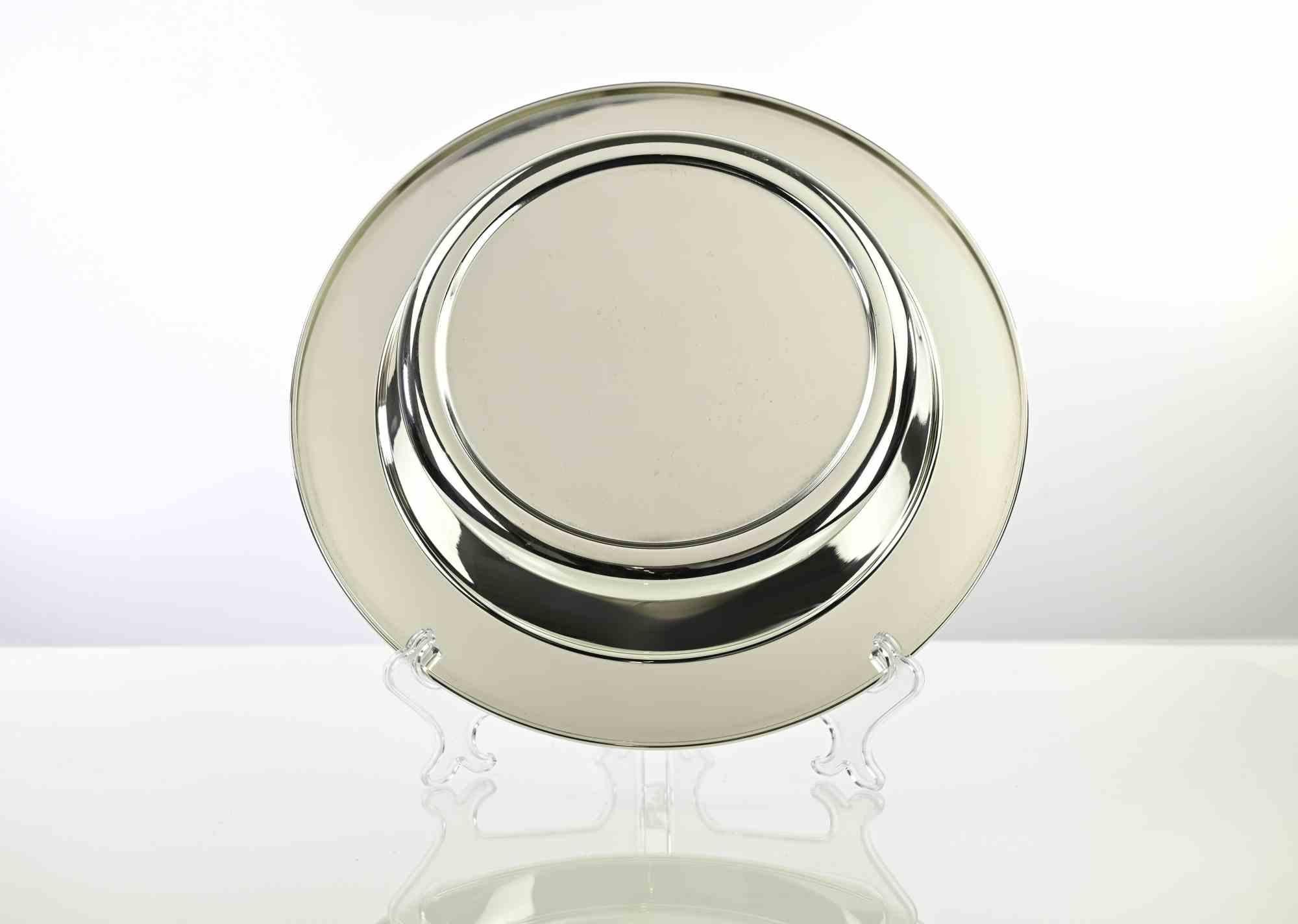 Assiette de service vintage en métal argenté, réalisée en Italie dans les années 1970.

Excellent état.