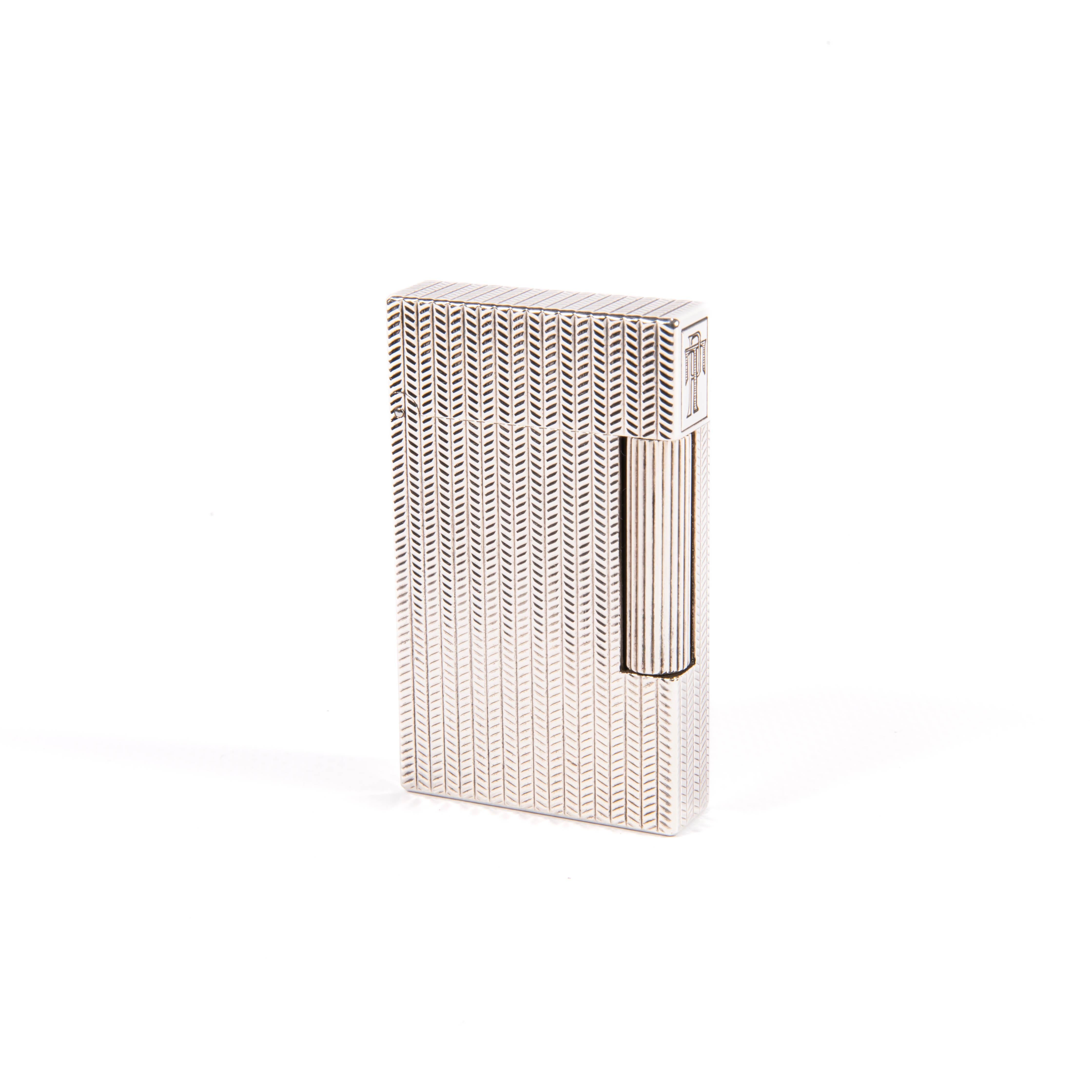 Vintage Authentic Silver plated Ligne 2 ST Dupont Lighter from the 1990s

The iconic S.T. Dupont name is known for quality, well-made cigarette lighters and other luxury implements. The company’s origin can be traced to Simon Tissot-Dupont opening