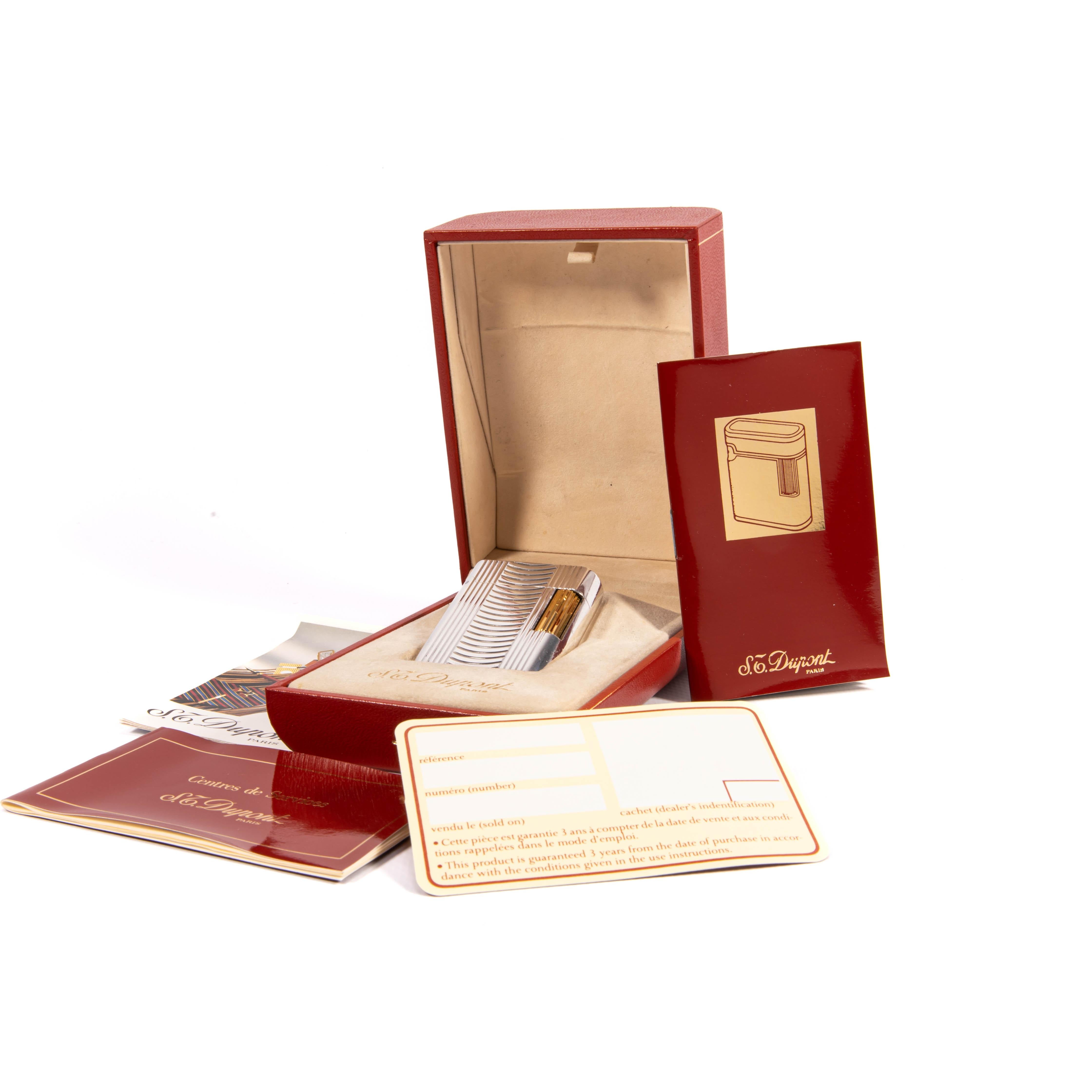 Vintage Silver Plated ST Dupont Soubreny Lighter 1990s In Box

The iconic S.T. Dupont name is known for quality, well-made cigarette lighters and other luxury implements. The company’s origin can be traced to Simon Tissot-Dupont opening his workshop