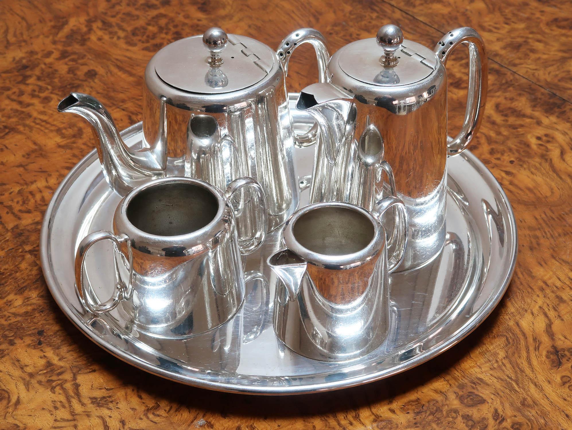 Very smart silver plated matching 4 piece tea set on a tray

Fabulous quality. 

Makers marks on the underside of each piece

No rubbing to the silver plate. 

The measurement relates to the teapot

Free UK shipping









 
