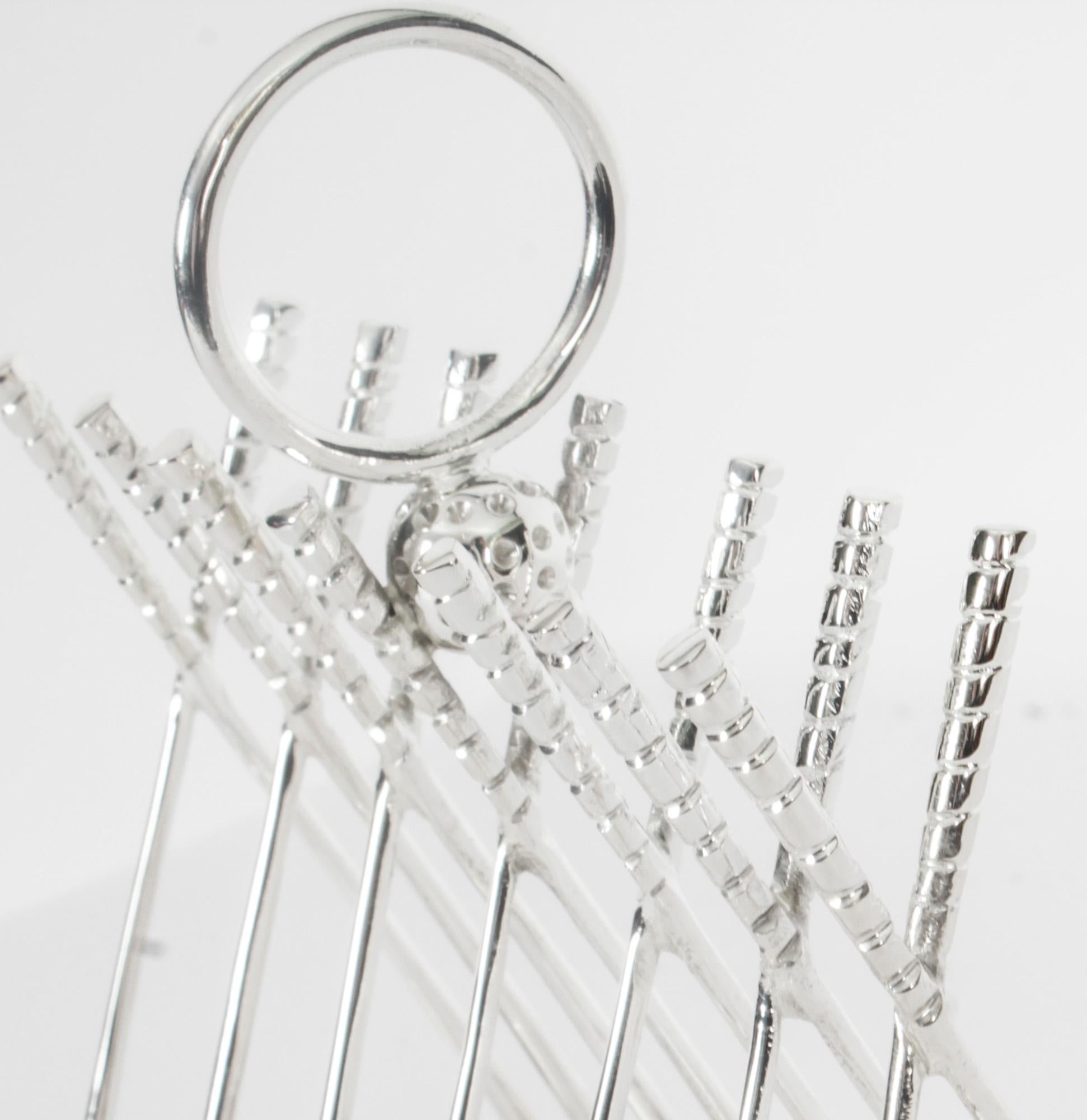 This is a delightful Vintage silver plated toast rack. The toast is held in place by crossed golf clubs and the base stands on four golf balls, dating from the late 20th Century.

The craftsmanship and finish are of the highest quality.
 
An elegant