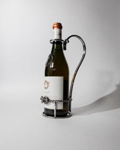 Porte-bouteille vintage en métal argenté de la marque Serra Roma, années 1930