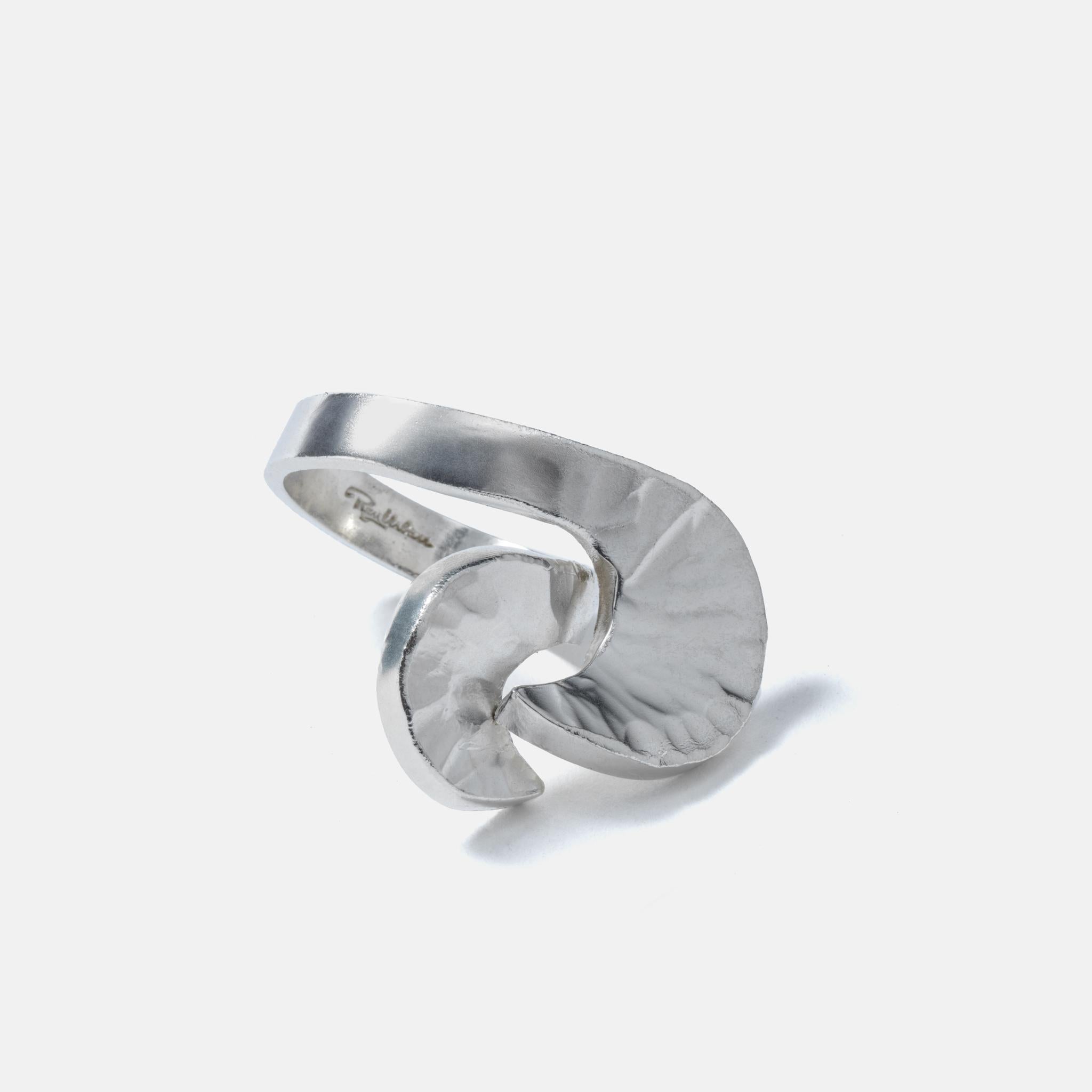 This is a typical 1970s design from one of Swedens at the time best silversmiths, Rey Urban. He is playing with the shapes and creates two half-moons that meet each other. The silver surface is partly shiny and partly matt.

This is a great ring to