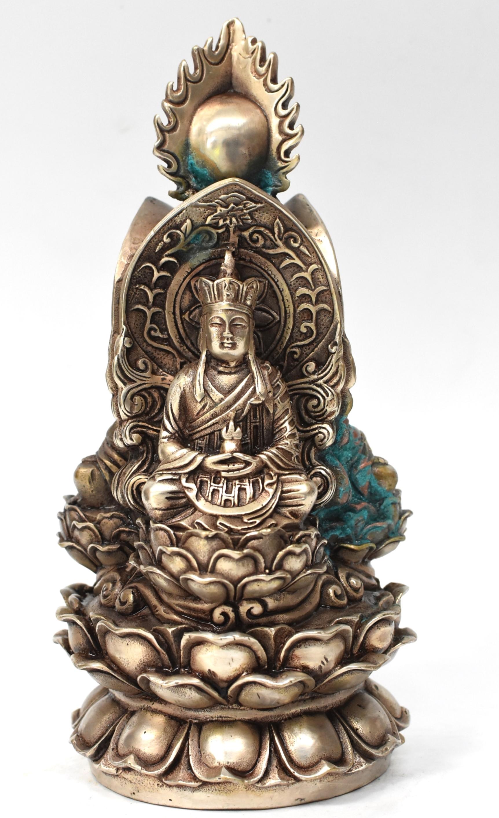 This is a very special, unique piece. The silver brass statue is a three sided Buddha statue featuring the Buddha, Buddha of Earth, Kwan Yin Goddess of Great Compassion. They are seated on a high lotus seat, in their respective alcove. A stylized