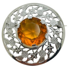 Broche de diseño vintage de cristal ámbar en tono plateado