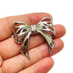 Vintage silver tone bow brooch