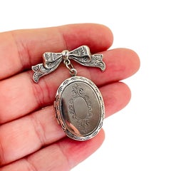 Vintage silver tone bow dangle locket designer brooch