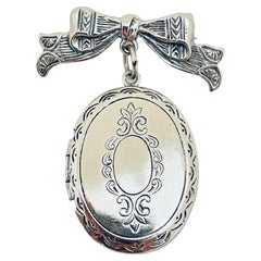 Vintage silver tone bow dangle locket designer brooch