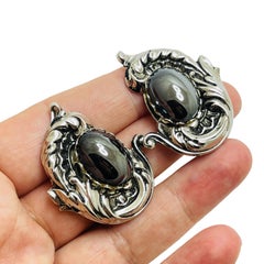 Vintage silver tone designer clip on earrings